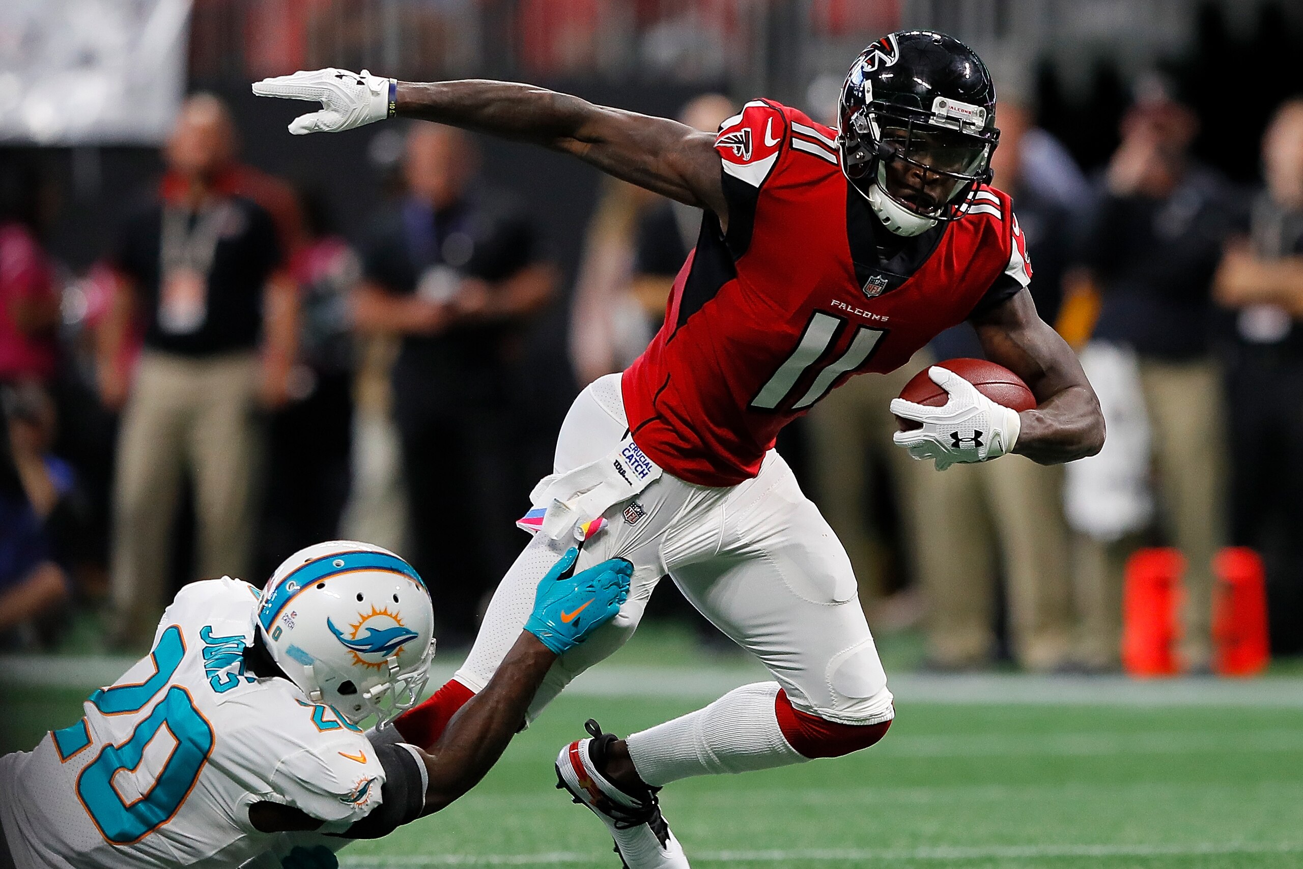 ATLANTA, GA - OCTOBER 15:  Julio Jones #11 of the Atlanta Falcons battles for more yardage against Reshad Jones #20 of the Miami Dolphins at Mercedes-Benz Stadium on October 15, 2017 in Atlanta, Georgia.  (Photo by Kevin C. Cox/Getty Images)