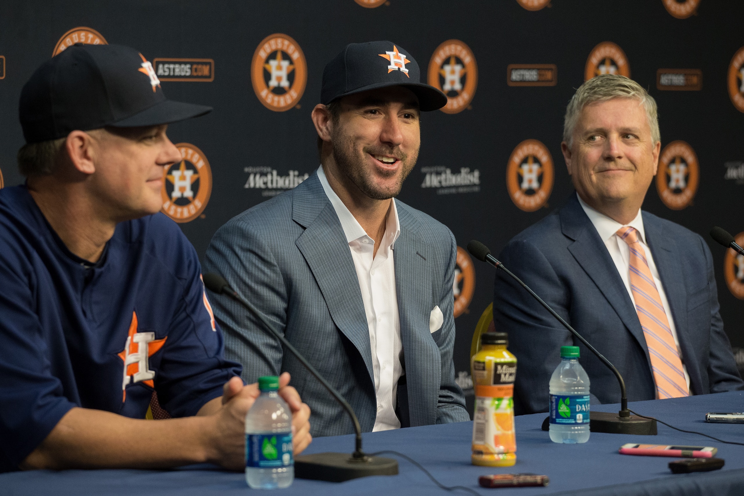 HOUSTON, TX - SEPTEMBER 03:  Justin Verlander , center, along with manager A.J. Hinch, left, and general manager Jeff Luhnow during a press conference to officially introduce Verlander at Minute Maid Park on September 3, 2017 in Houston, Texas.  (Photo by