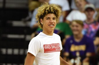 LAS VEGAS, NV - JULY 08:  LaMelo Ball, brother of Lonzo Ball #2 of the Los Angeles Lakers, smiles before shooting baskets as part of a promotion during a timeout in a 2017 Summer League game between the Boston Celtics and the Lakers at the Thomas & Mack C