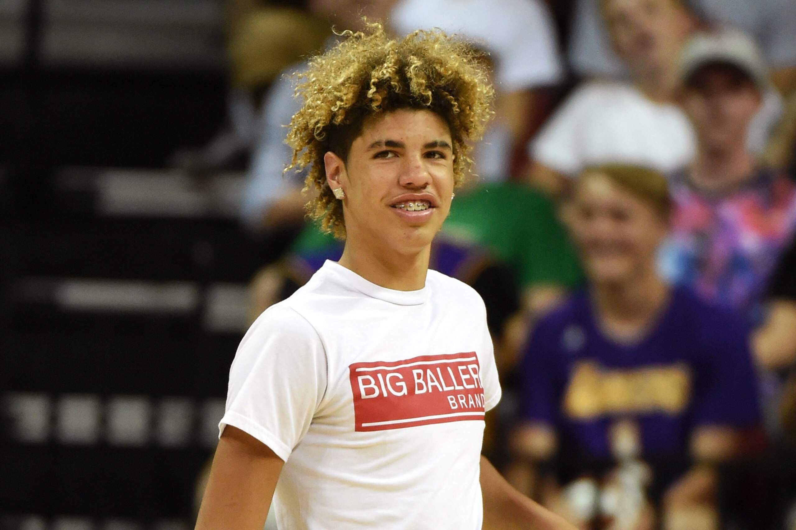 LAS VEGAS, NV - JULY 08: LaMelo Ball, brother of Lonzo Ball #2 of the Los Angeles Lakers, smiles before shooting baskets as part of a promotion during a timeout in a 2017 Summer League game between the Boston Celtics and the Lakers at the Thomas & Mack C LAS VEGAS, NV - JULY 08: LaMelo Ball, brother of Lonzo Ball #2 of the Los Angeles Lakers, smiles before shooting baskets as part of a promotion during a timeout in a 2017 Summer League game between the Boston Celtics and the Lakers at the Thomas & Mack C