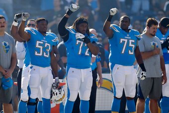 Perry (No. 53) raising a fist on the sideline while with the Chargers in 2016.