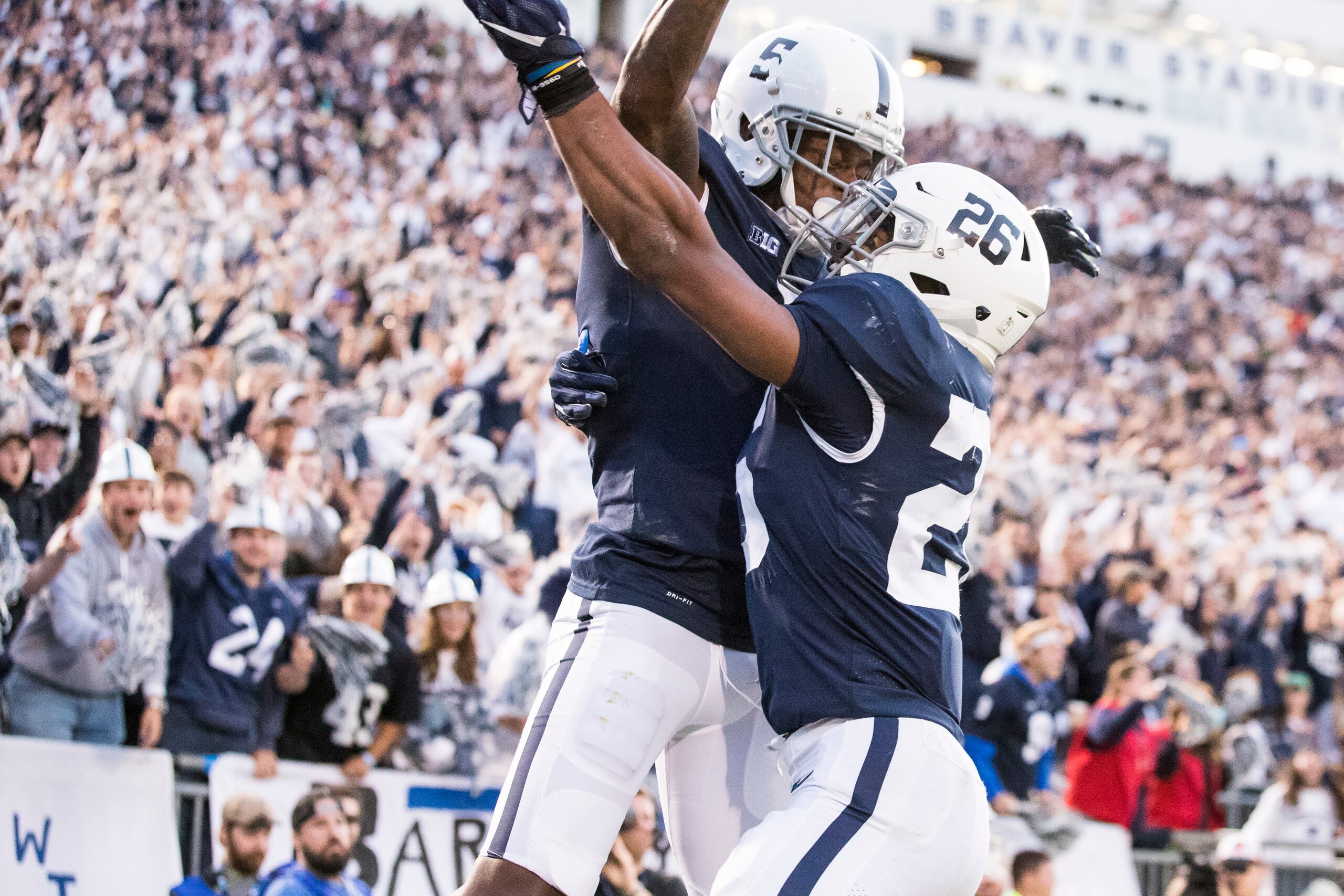 UNIVERSITY PARK, PA - SEPTEMBER 30:  DaeSean Hamilton #5 is congratulated by Saquon Barkley #26 of the Penn State Nittany Lions after Barkley threw Hamilton a touchdown pass during the fourth quarter against the Indiana Hoosiers on September 30, 2017 at B