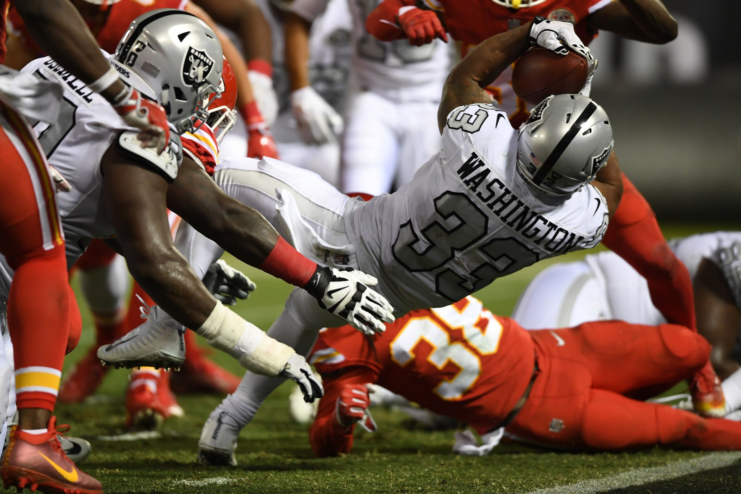OAKLAND, CA - OCTOBER 19:  DeAndre Washington #33 of the Oakland Raiders scores on a four-yard run against the Kansas City Chiefs during their NFL game at Oakland-Alameda County Coliseum on October 19, 2017 in Oakland, California.  (Photo by Thearon W. He