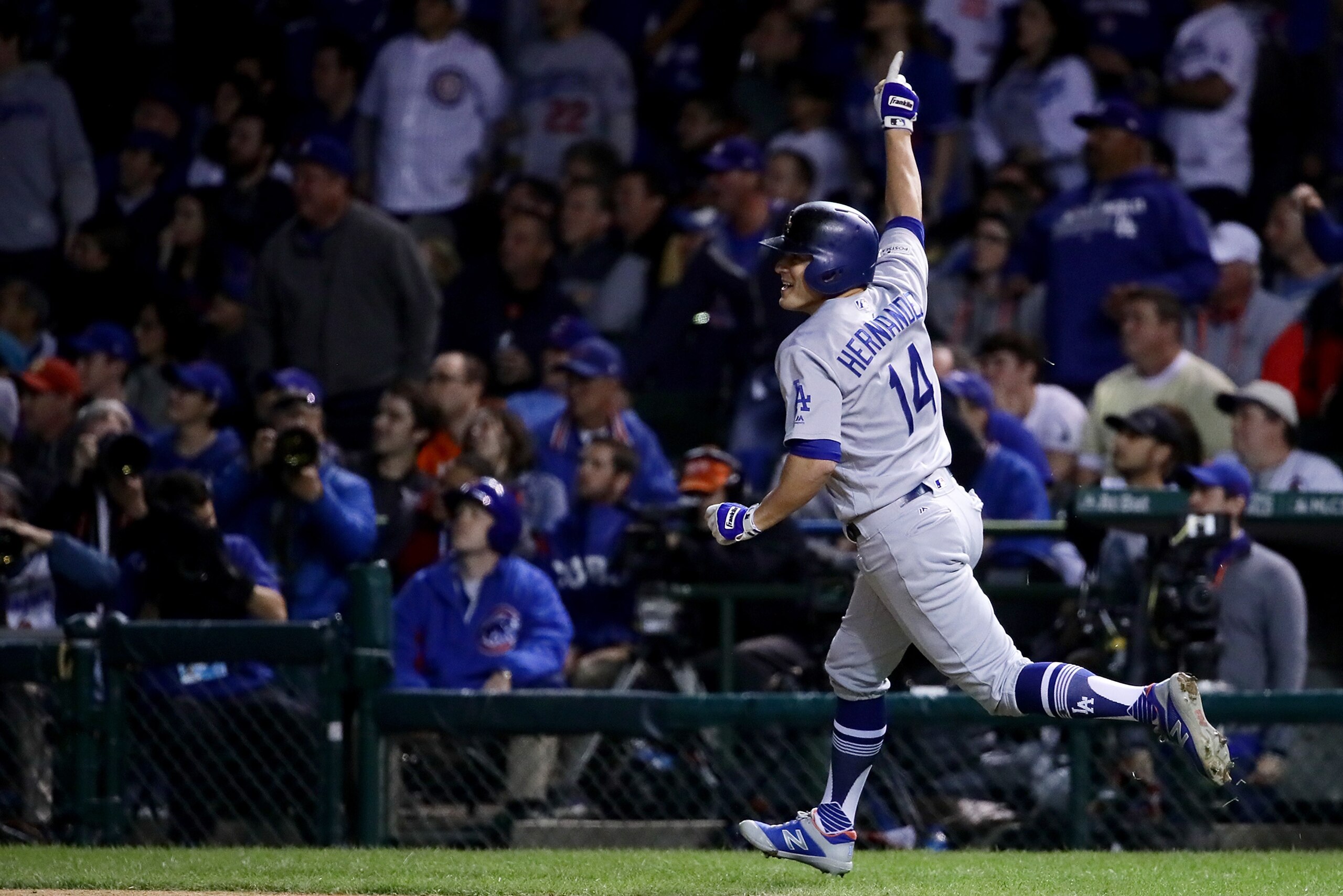 CHICAGO, IL - OCTOBER 19:  Enrique Hernandez #14 of the Los Angeles Dodgers celebrates hitting a home run in the ninth inning against the Chicago Cubs during game five of the National League Championship Series at Wrigley Field on October 19, 2017 in Chic