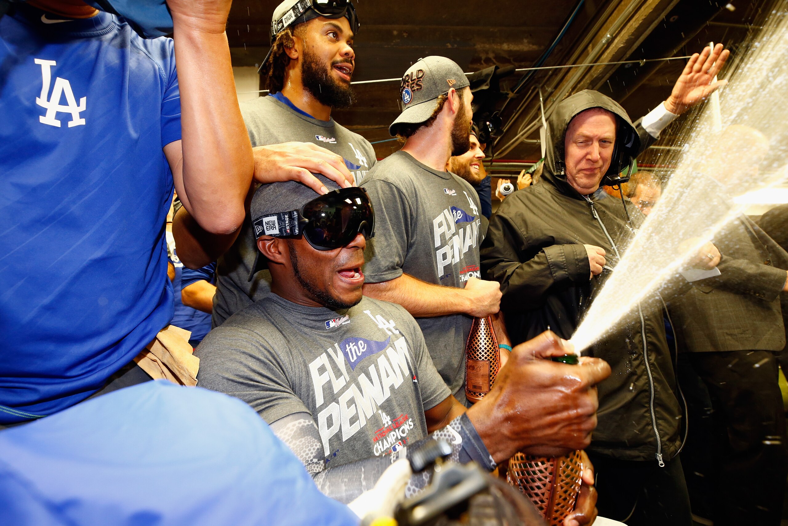 CHICAGO, IL - OCTOBER 19:  Yasiel Puig #66 of the Los Angeles Dodgers celebrates in the clubhouse after defeating the Chicago Cubs 11-1 in game five of the National League Championship Series at Wrigley Field on October 19, 2017 in Chicago, Illinois. The 