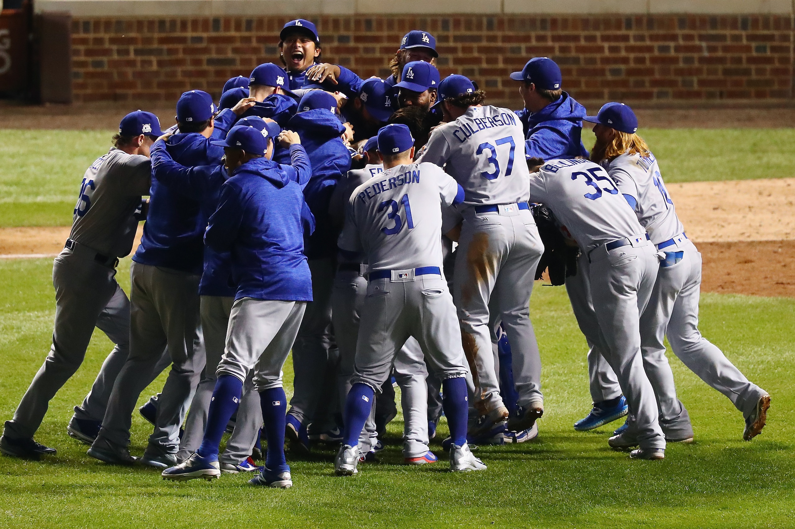 CHICAGO, IL - OCTOBER 19:  The Los Angeles Dodgers celebrate defeating the Chicago Cubs 11-1 in game five of the National League Championship Series at Wrigley Field on October 19, 2017 in Chicago, Illinois. The Dodgers advance to the 2017 World Series.  