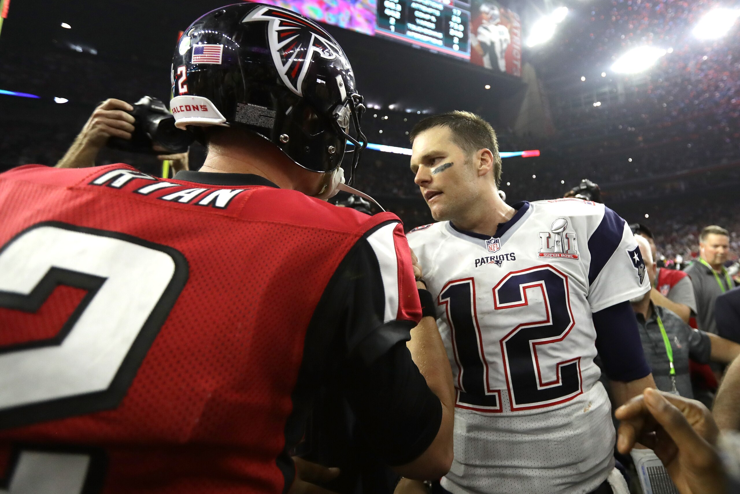 HOUSTON, TX - FEBRUARY 05:  Tom Brady #12 of the New England Patriots speaks to Matt Ryan #2 of the Atlanta Falcons after winning Super Bowl 51 at NRG Stadium on February 5, 2017 in Houston, Texas. The Patriots defeated the Falcons 34-28.  (Photo by Ronal