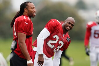 Larry Fitzgerald, left, and Adrian Peterson