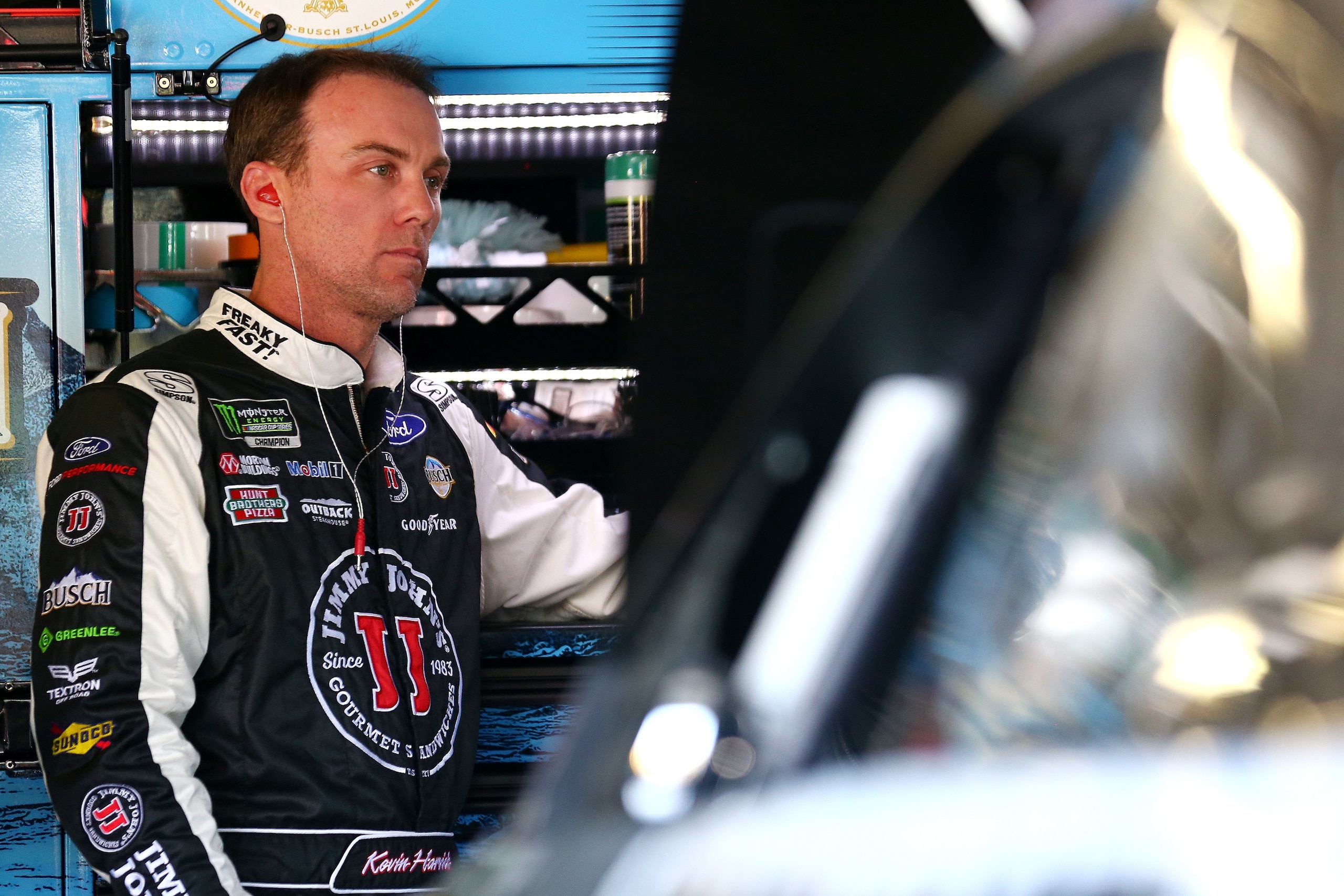 KANSAS CITY, KS - OCTOBER 20:  Kevin Harvick, driver of the #4 Jimmy John's Ford, stands in the garage during practice for the Monster Energy NASCAR Cup Series Hollywood Casino 400 at Kansas Speedway on October 20, 2017 in Kansas City, Kansas.  (Photo by 