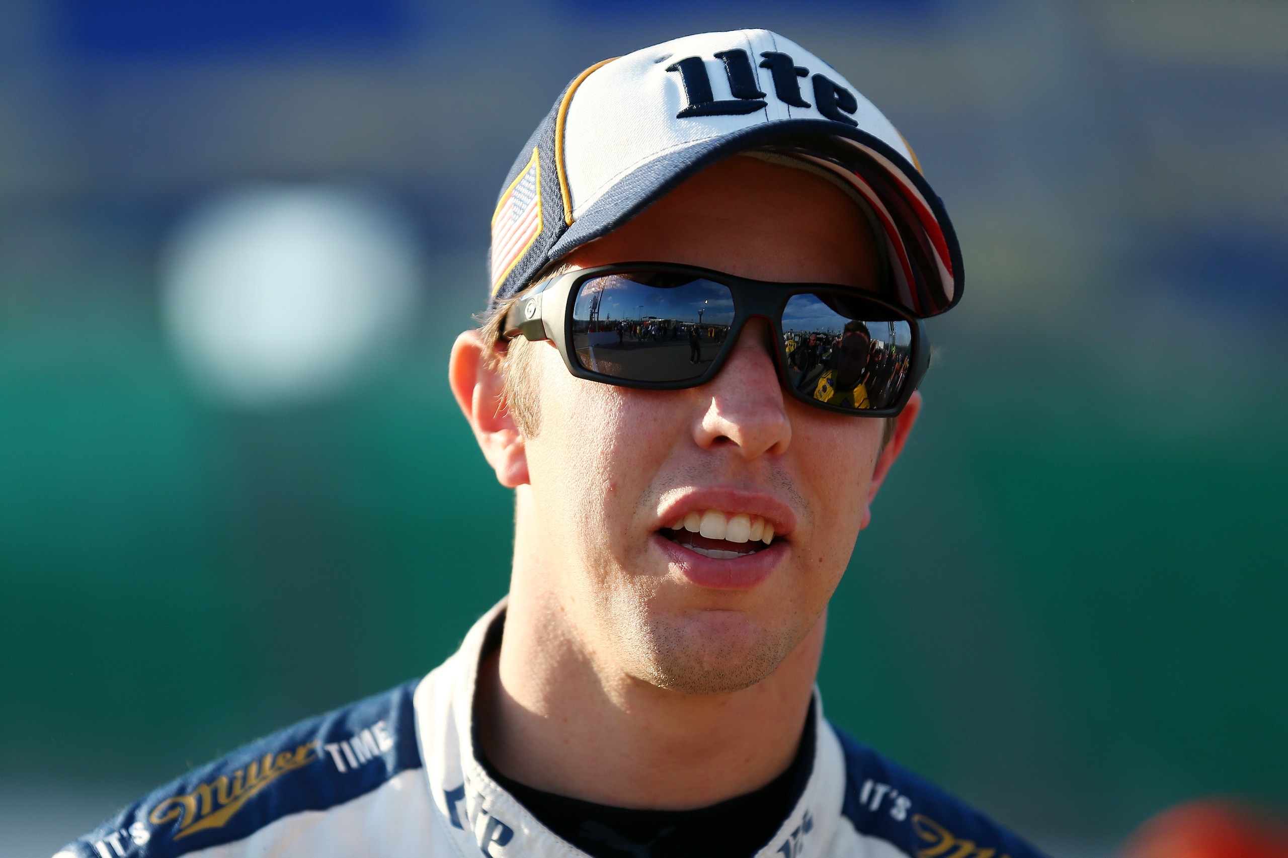 KANSAS CITY, KS - OCTOBER 20:  Brad Keselowski, driver of the #2 Miller Lite Ford, stands on the grid during qualifying for the Monster Energy NASCAR Cup Series Hollywood Casino 400 at Kansas Speedway on October 20, 2017 in Kansas City, Kansas.  (Photo by