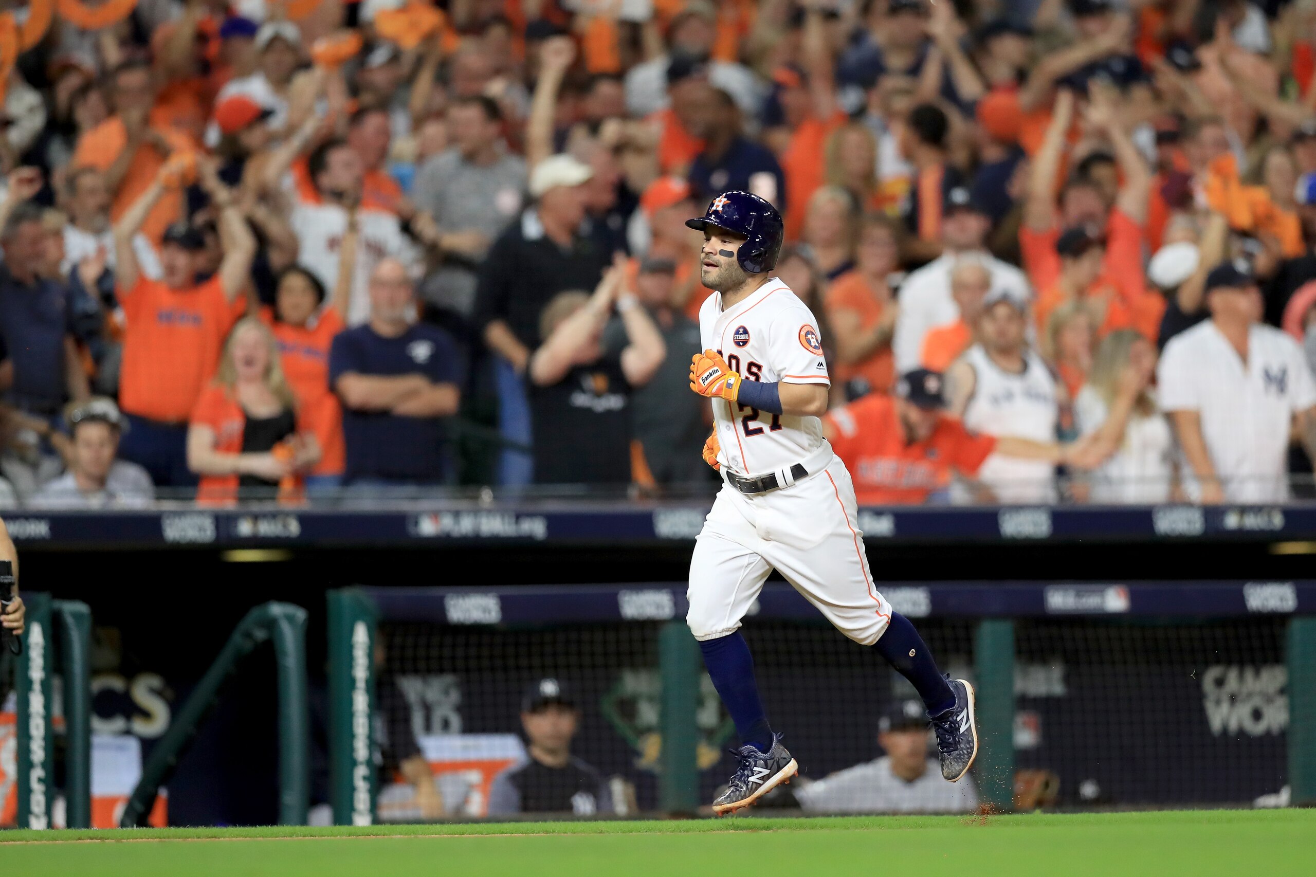 HOUSTON, TX - OCTOBER 20:  Jose Altuve #27 of the Houston Astros celebrates after hitting a solo home run against David Robertson #30 of the New York Yankees during the eighth inning in Game Six of the American League Championship Series at Minute Maid Pa