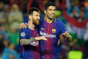 Barcelona's Argentinian forward Lionel Messi (L) and Barcelona's Uruguayan forward Luis Suarez celebrate Barcelona's  French defender Lucas Digne's goal during the UEFA Champions League group D football match FC Barcelona vs Olympiacos FC at the Camp Nou 