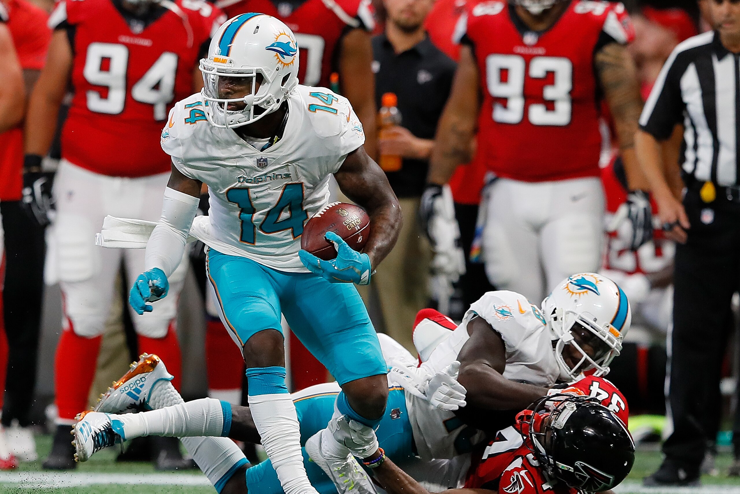ATLANTA, GA - OCTOBER 15: Jarvis Landry #14 of the Miami Dolphins attempts to break a tackle by Brian Poole #34 of the Atlanta Falcons at Mercedes-Benz Stadium on October 15, 2017 in Atlanta, Georgia. (Photo by Kevin C. Cox/Getty Images) ATLANTA, GA - OCTOBER 15: Jarvis Landry #14 of the Miami Dolphins attempts to break a tackle by Brian Poole #34 of the Atlanta Falcons at Mercedes-Benz Stadium on October 15, 2017 in Atlanta, Georgia. (Photo by Kevin C. Cox/Getty Images)