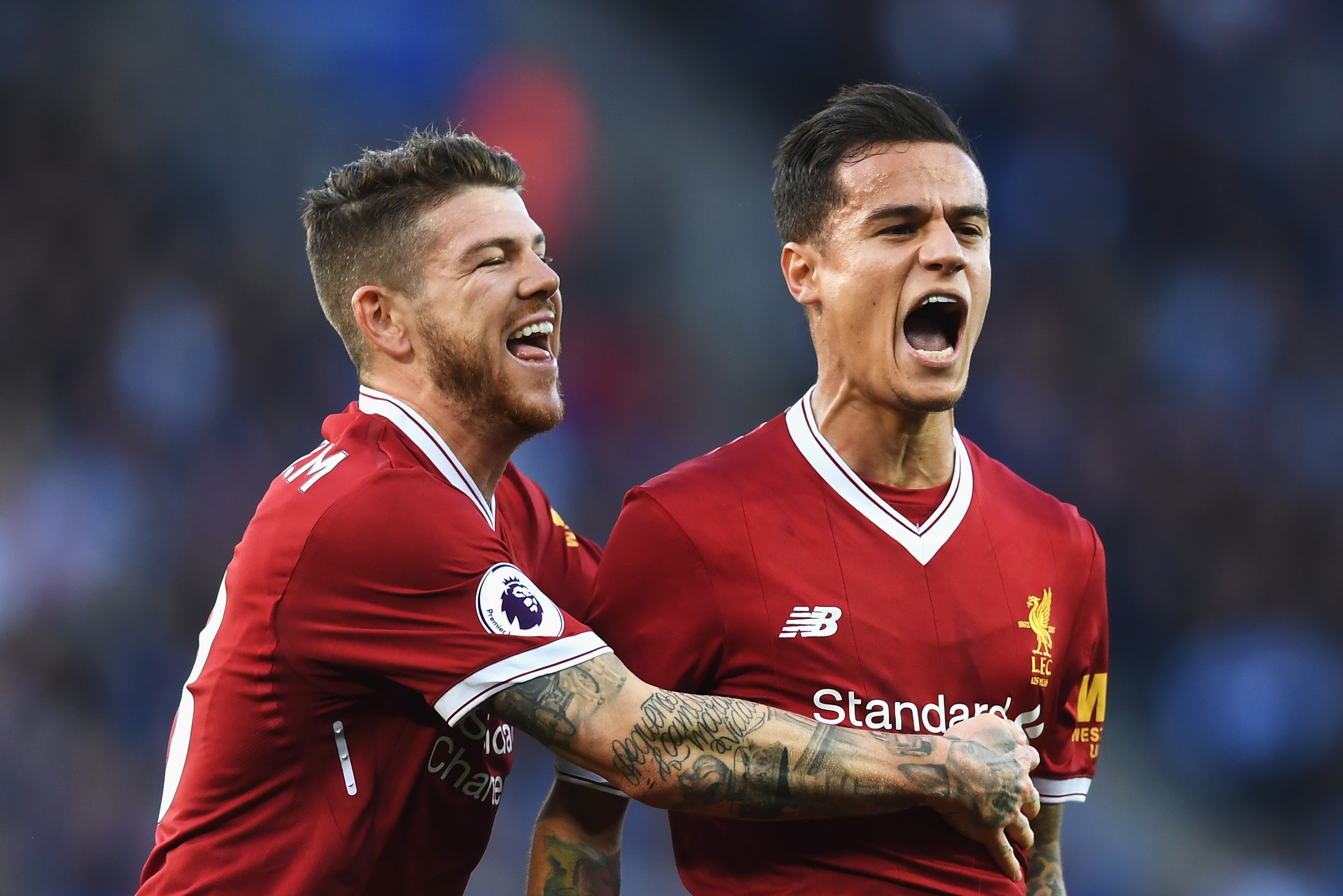 LEICESTER, ENGLAND - SEPTEMBER 23:  Philippe Coutinho of Liverpool celebrates scoring his sides second goal with Alberto Moreno of Liverpool  during the Premier League match between Leicester City and Liverpool at The King Power Stadium on September 23, 2