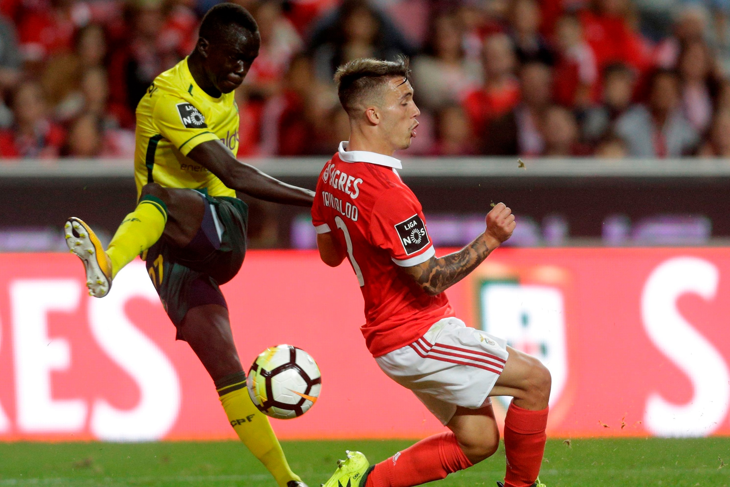 Benfica's Spanish defender Alex Grimaldo (R) vies with Pacos Ferreira's Australian forward Awer Mabil during the Portuguese league football match SL Benfica vs FC Pacos de Ferreira at the Luz stadium in Lisbon on September 23, 2017. / AFP PHOTO / JOSE MAN Benfica's Spanish defender Alex Grimaldo (R) vies with Pacos Ferreira's Australian forward Awer Mabil during the Portuguese league football match SL Benfica vs FC Pacos de Ferreira at the Luz stadium in Lisbon on September 23, 2017. / AFP PHOTO / JOSE MAN