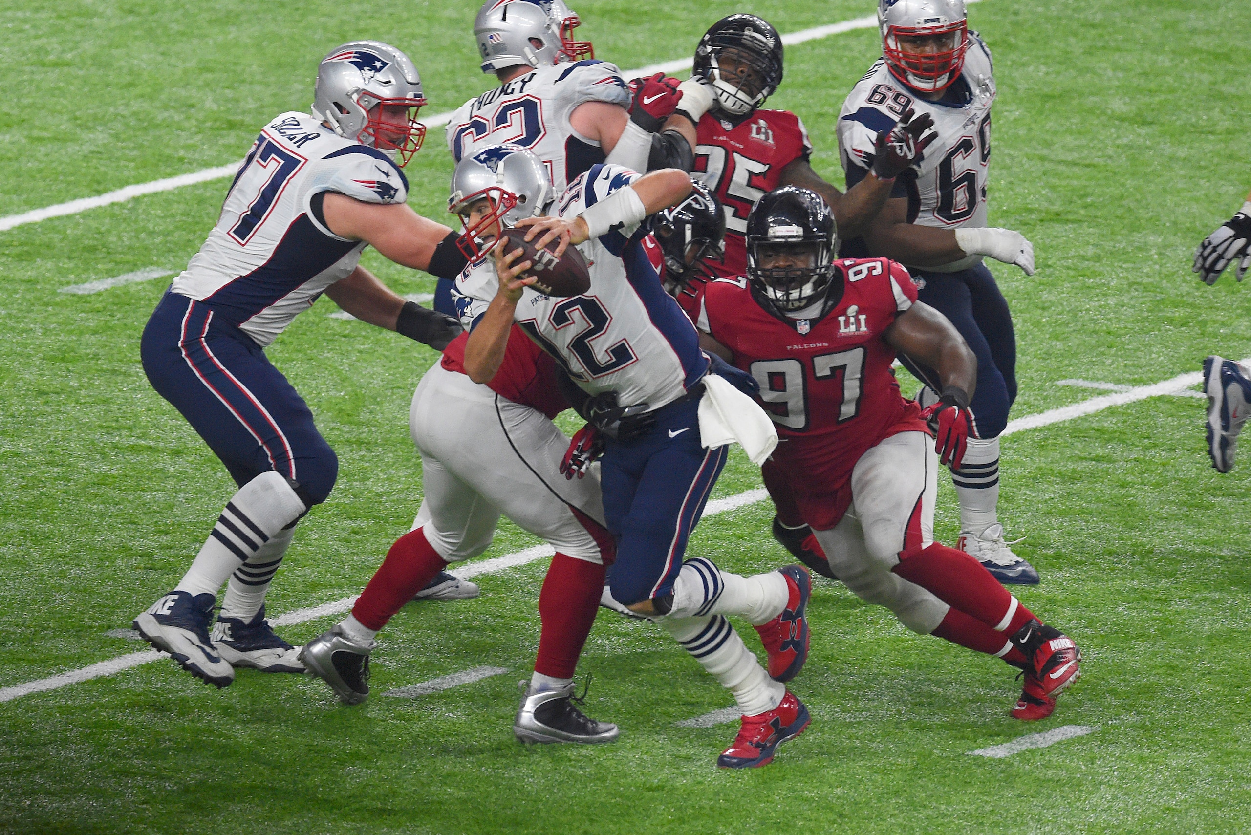 HOUSTON, TX - FEBRUARY 05:  Grady Jarrett #97 of the Atlanta Falcons pursues Tom Brady #12 of the New England Patriots during Super Bowl 51 at NRG Stadium on February 5, 2017 in Houston, Texas. The Patriots defeat the Atlanta Falcons 34-28 in overtime. (P