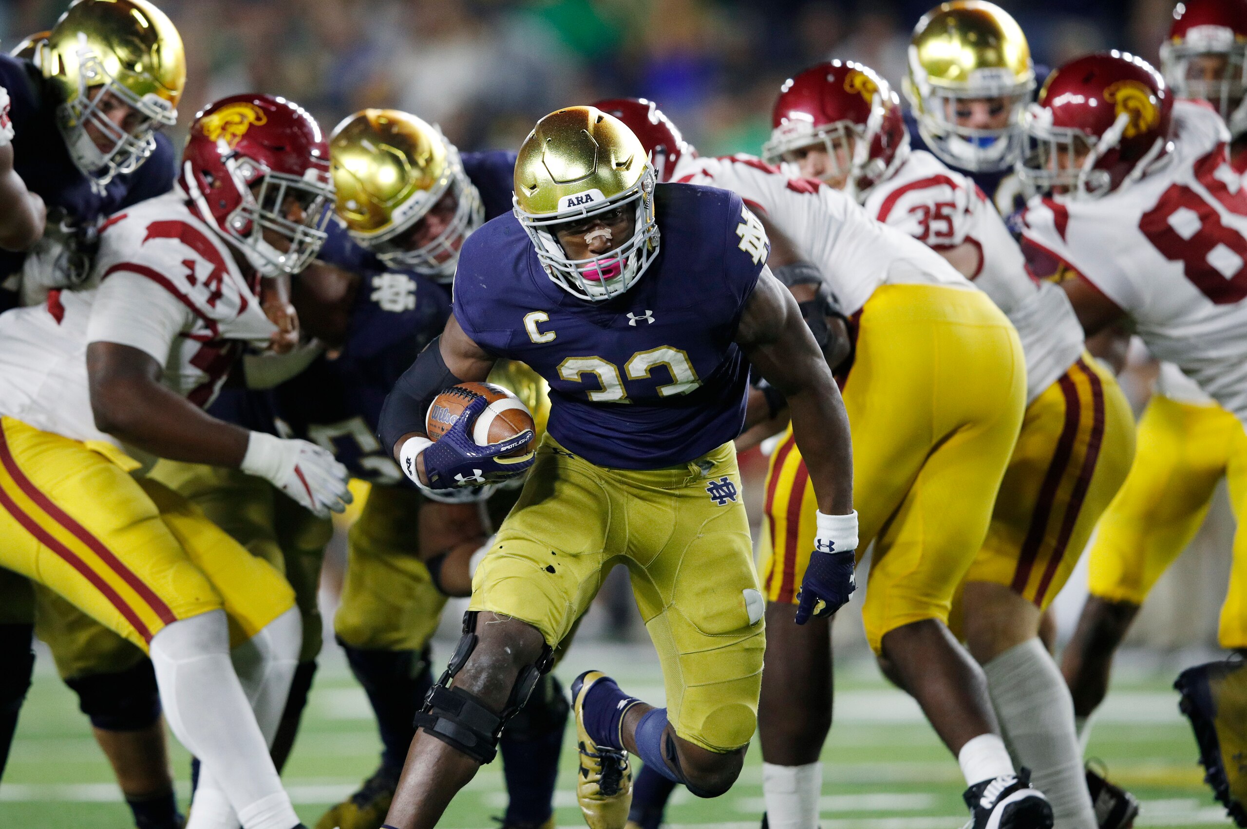 SOUTH BEND, IN - OCTOBER 21: Josh Adams #33 of the Notre Dame Fighting Irish runs for a 14-yard touchdown in the fourth quarter of a game against the USC Trojans at Notre Dame Stadium on October 21, 2017 in South Bend, Indiana. Notre Dame won 49-14. (Phot