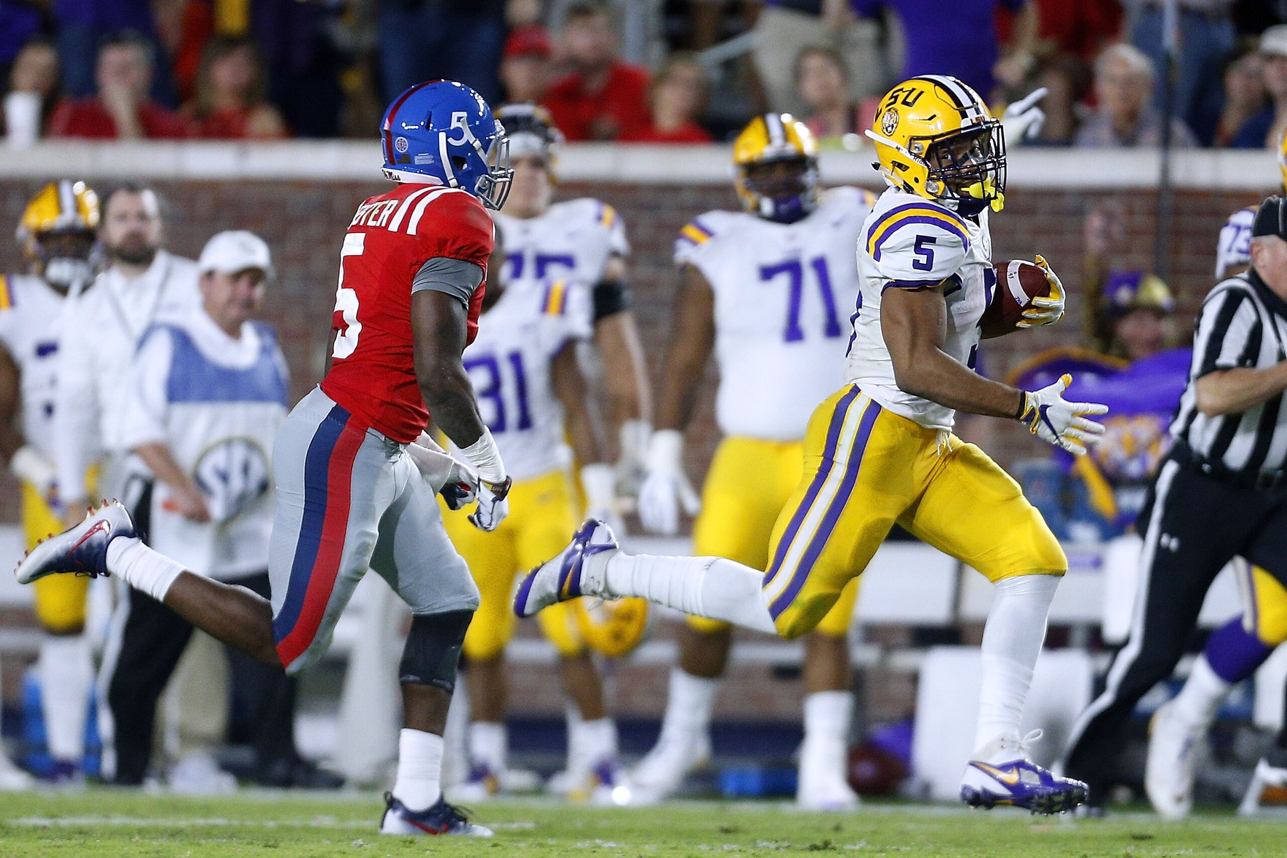 OXFORD, MS - OCTOBER 21:  Derrius Guice #5 of the LSU Tigers runs with the ball as Ken Webster #5 of the Mississippi Rebels defends during the second half of a game at Vaught-Hemingway Stadium on October 21, 2017 in Oxford, Mississippi.  (Photo by Jonatha