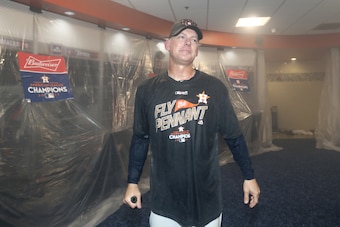 HOUSTON, TX - OCTOBER 21:  A.J. Hinch #14 of the Houston Astros celebrates in the locker room after defeating the New York Yankees by a score of 4-0 to win Game Seven of the American League Championship Series at Minute Maid Park on October 21, 2017 in Ho