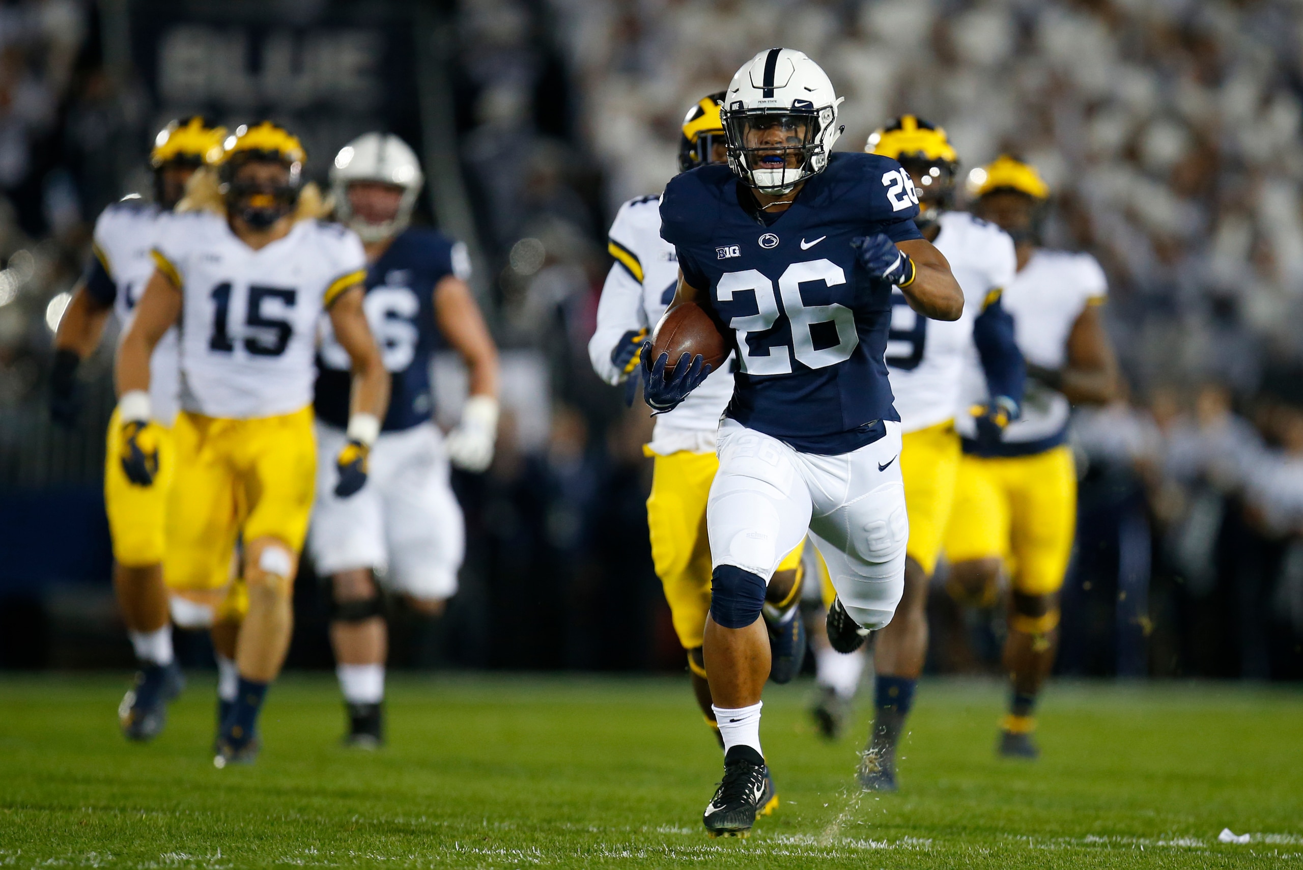 STATE COLLEGE, PA - OCTOBER 21:  Saquon Barkley #26 of the Penn State Nittany Lions rushes for a 69 yard touchdown in the first half against the Michigan Wolverines on October 21, 2017 at Beaver Stadium in State College, Pennsylvania.  (Photo by Justin K.