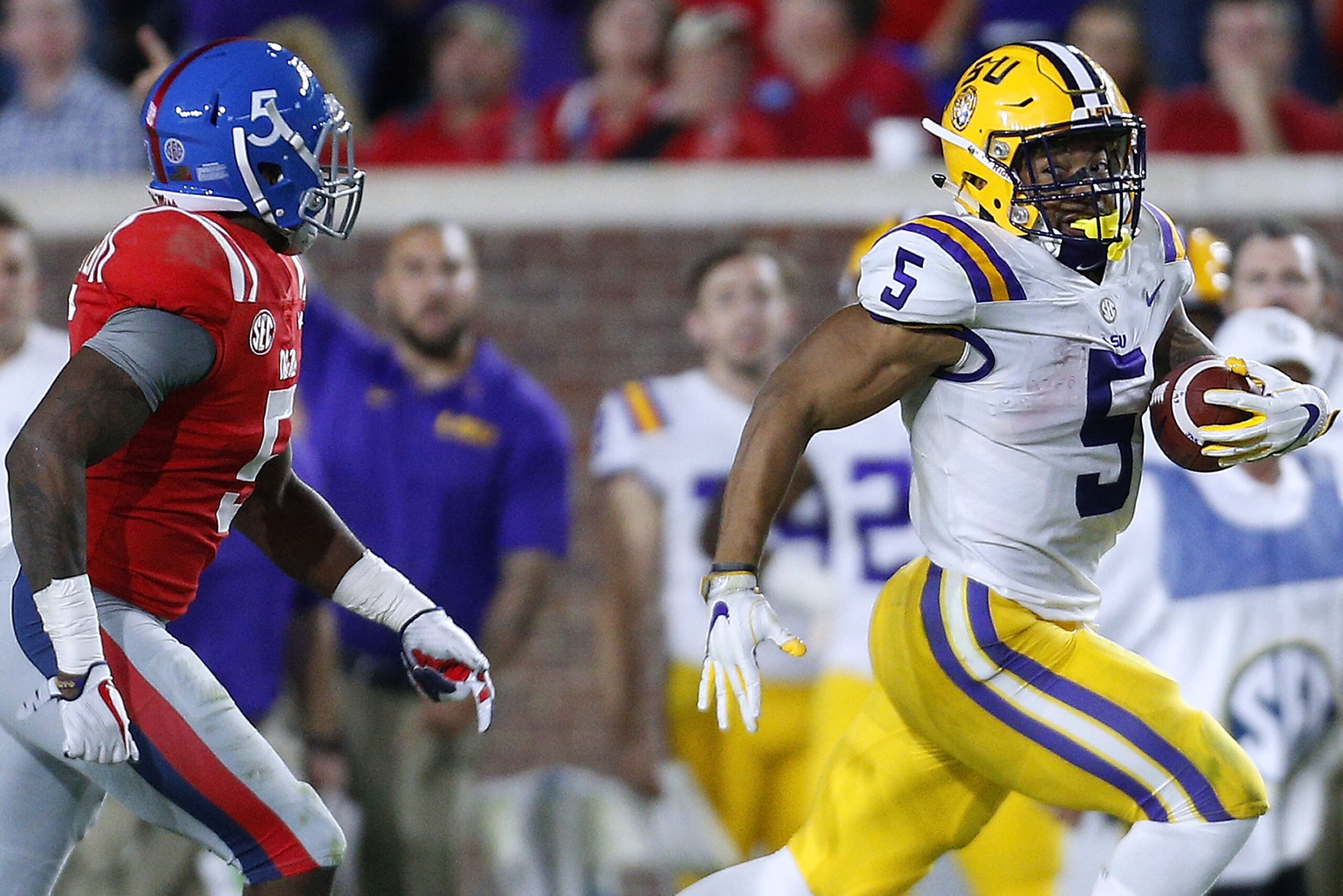 OXFORD, MS - OCTOBER 21:  Derrius Guice #5 of the LSU Tigers runs with the ball as Ken Webster #5 of the Mississippi Rebels defends during the second half of a game at Vaught-Hemingway Stadium on October 21, 2017 in Oxford, Mississippi.  (Photo by Jonatha
