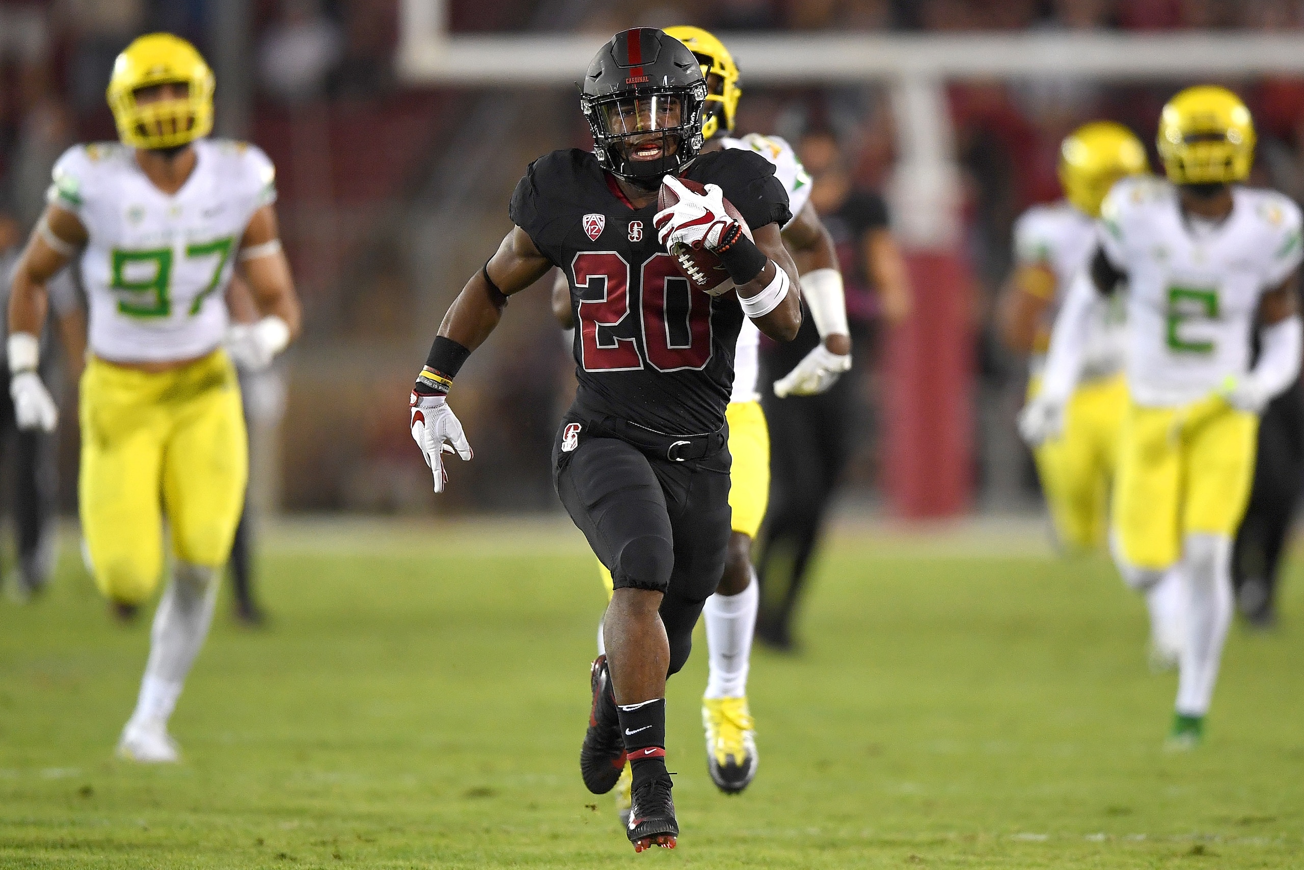 PALO ALTO, CA - OCTOBER 14:  Bryce Love #20 of the Stanford Cardinal scores on a sixty seven yard touchdown run against the Oregon Ducks during the first quarter of the NCAA football game at Stanford Stadium on October 14, 2017 in Palo Alto, California.  