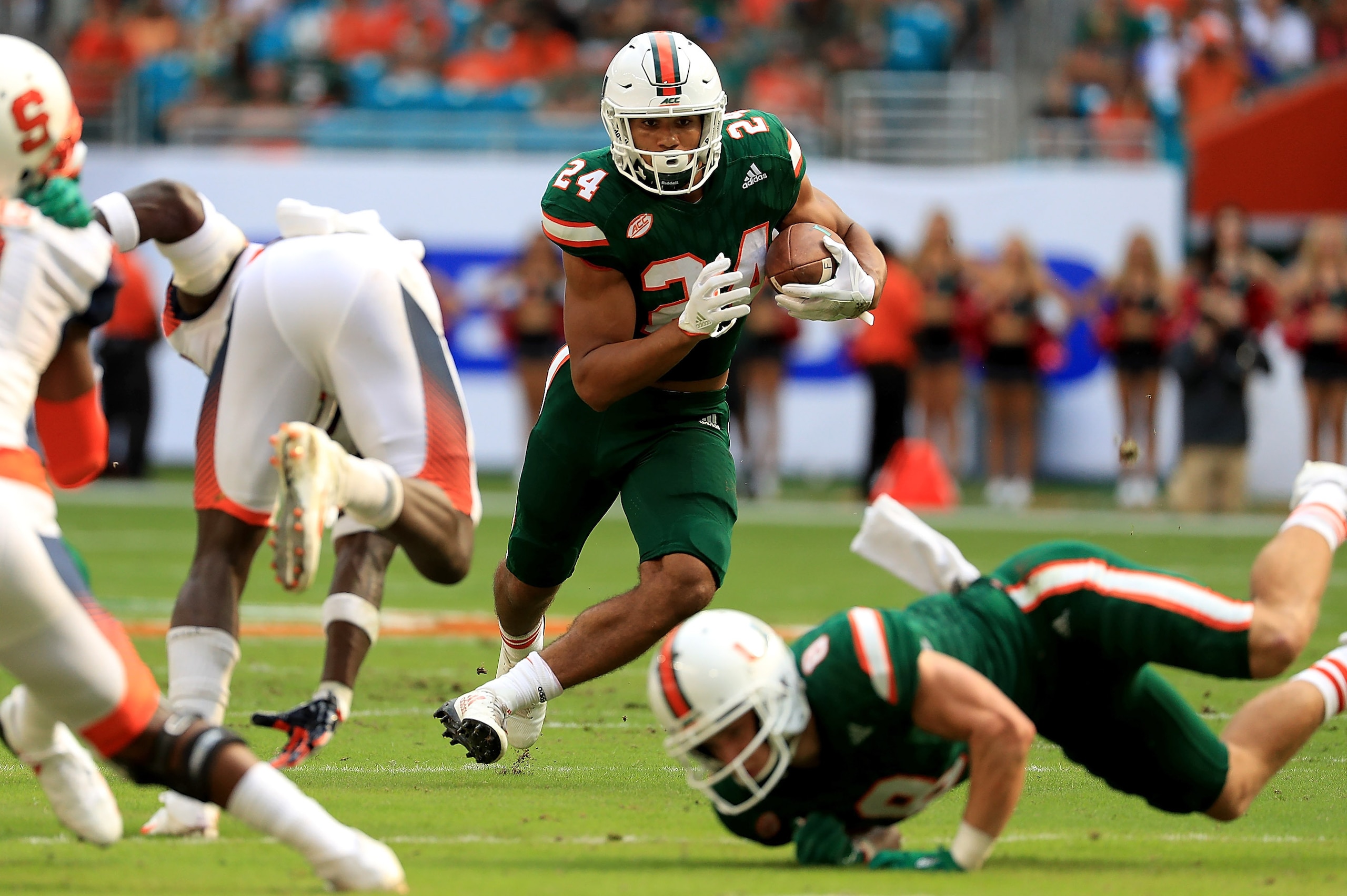 MIAMI GARDENS, FL - OCTOBER 21:  Travis Homer #24 of the Miami Hurricanes rushes during a game against the Syracuse Orange at Sun Life Stadium on October 21, 2017 in Miami Gardens, Florida.  (Photo by Mike Ehrmann/Getty Images)