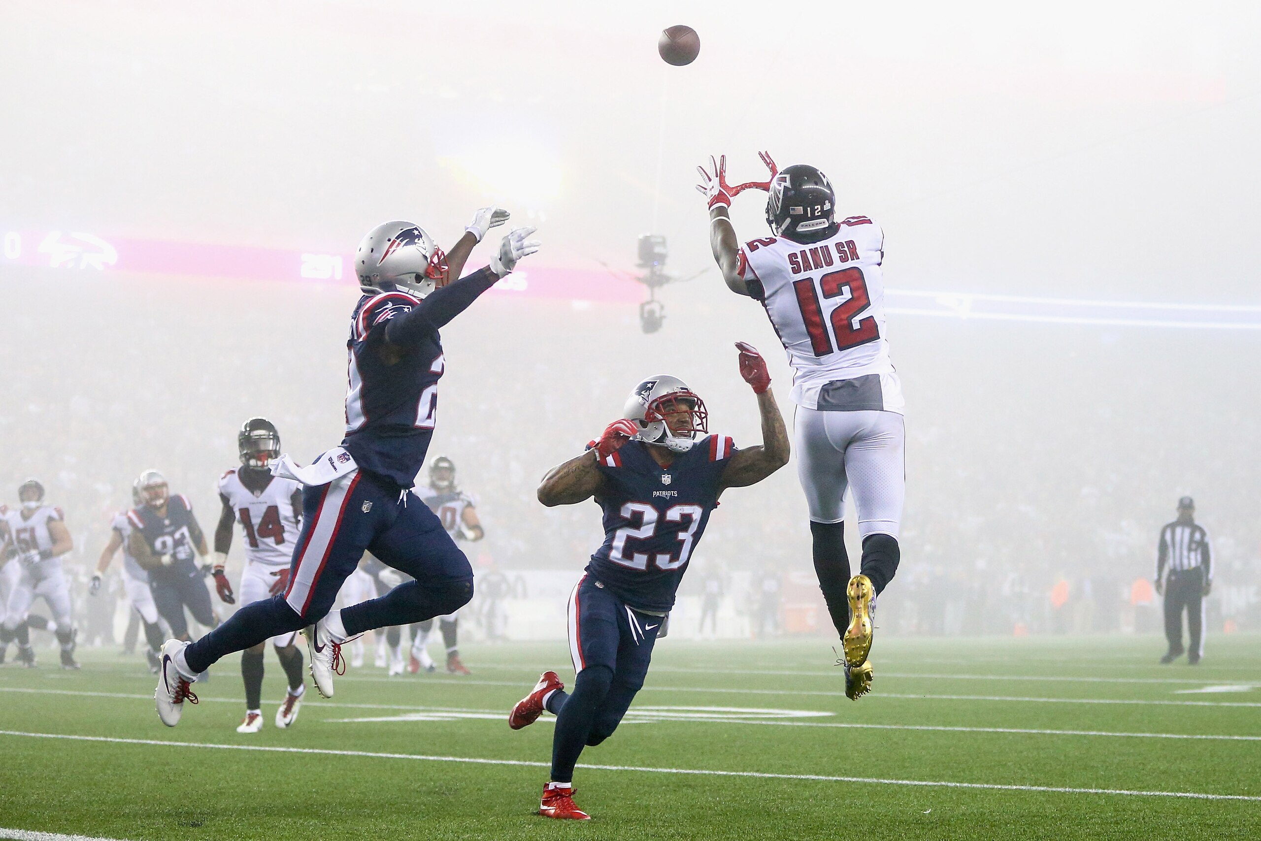 FOXBORO, MA - OCTOBER 22: Mohamed Sanu #12 of the Atlanta Falcons catches a pass as he is defended by Patrick Chung #23 of the New England Patriots during the fourth quarter of a game against the Atlanta Falcons at Gillette Stadium on October 22, 2017 in 
