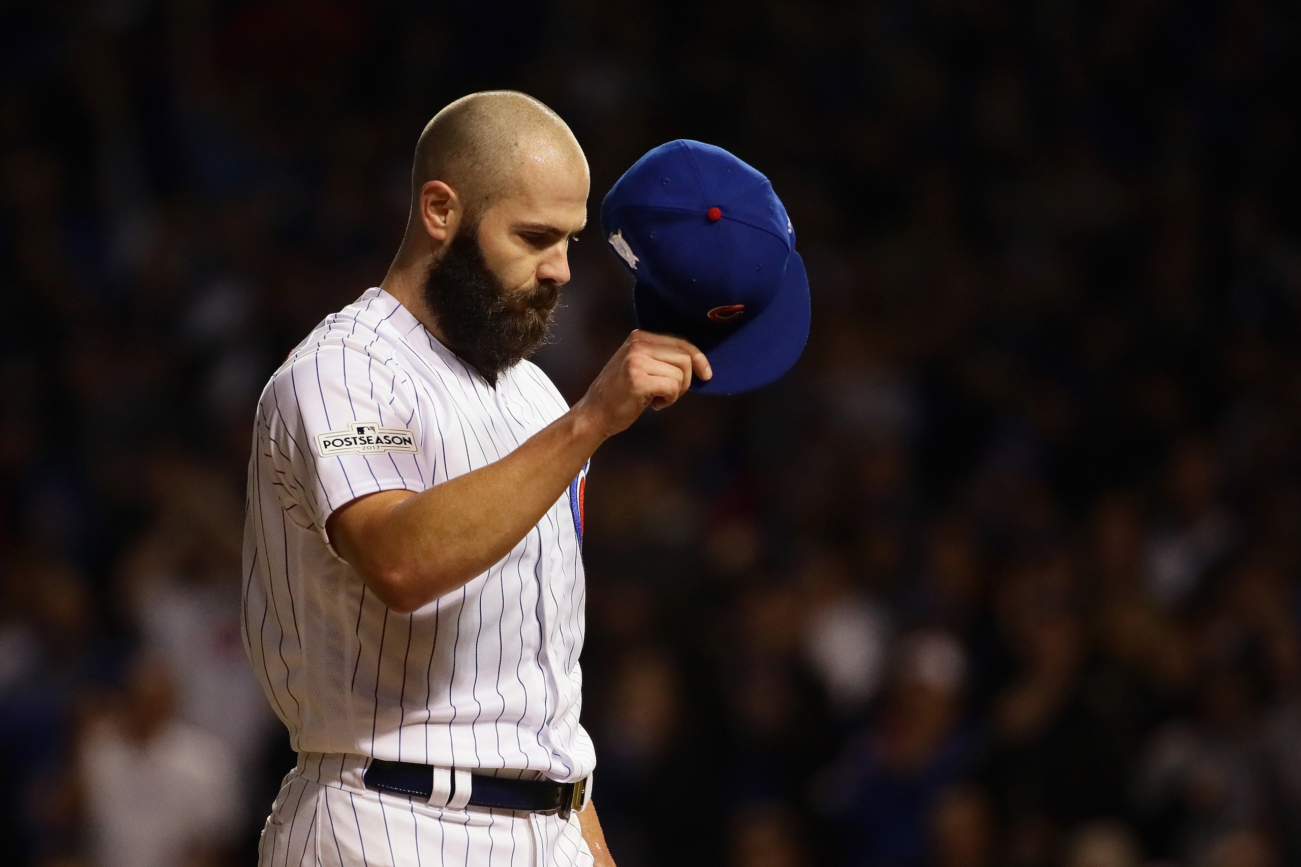 CHICAGO, IL - OCTOBER 18:  Jake Arrieta #49 of the Chicago Cubs acknowledges the crowd after being relieved in the seventh inning against the Los Angeles Dodgers during game four of the National League Championship Series at Wrigley Field on October 18, 2