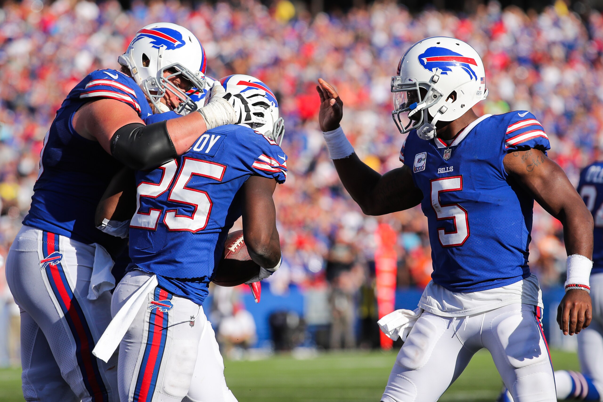 ORCHARD PARK, NY - OCTOBER 22: LeSean McCoy #25 of the Buffalo Bills celebrates after scoring a touchdown with Eric Wood #70 of the Buffalo Bills and Tyrod Taylor #5 of the Buffalo Bills during the fourth quarter of an NFL game against the Tampa Bay Bucc ORCHARD PARK, NY - OCTOBER 22: LeSean McCoy #25 of the Buffalo Bills celebrates after scoring a touchdown with Eric Wood #70 of the Buffalo Bills and Tyrod Taylor #5 of the Buffalo Bills during the fourth quarter of an NFL game against the Tampa Bay Bucc