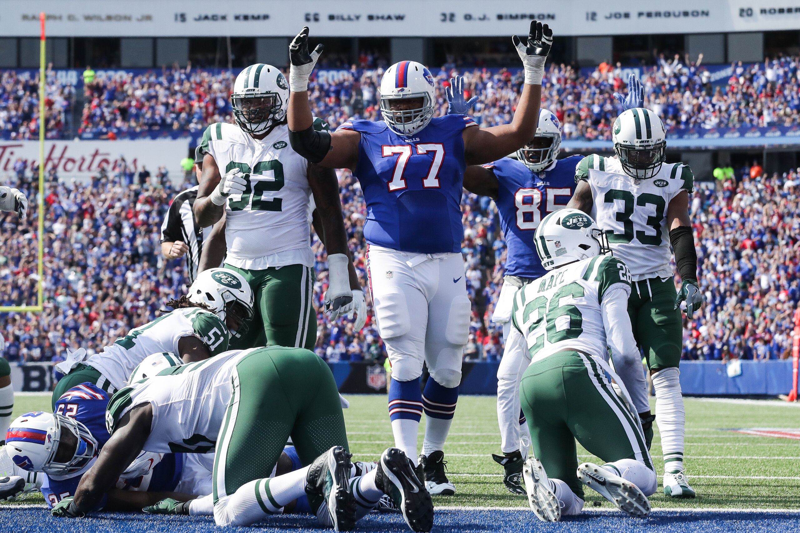 ORCHARD PARK, NY - SEPTEMBER 10:  Cordy Glenn #77 of the Buffalo Bills signals touchdown during the second half against the New York Jets on September 10, 2017 at New Era Field in Orchard Park, New York.  (Photo by Tom Szczerbowski/Getty Images)