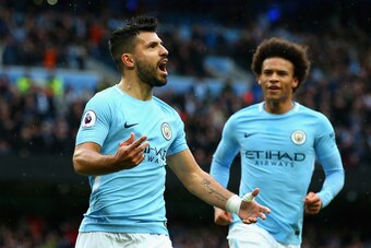 MANCHESTER, ENGLAND - OCTOBER 21:  Sergio Aguero of Manchester City celebrates as he scores their first goal from the penalty spot with Leroy Sane of Manchester City  during the Premier League match between Manchester City and Burnley at Etihad Stadium on