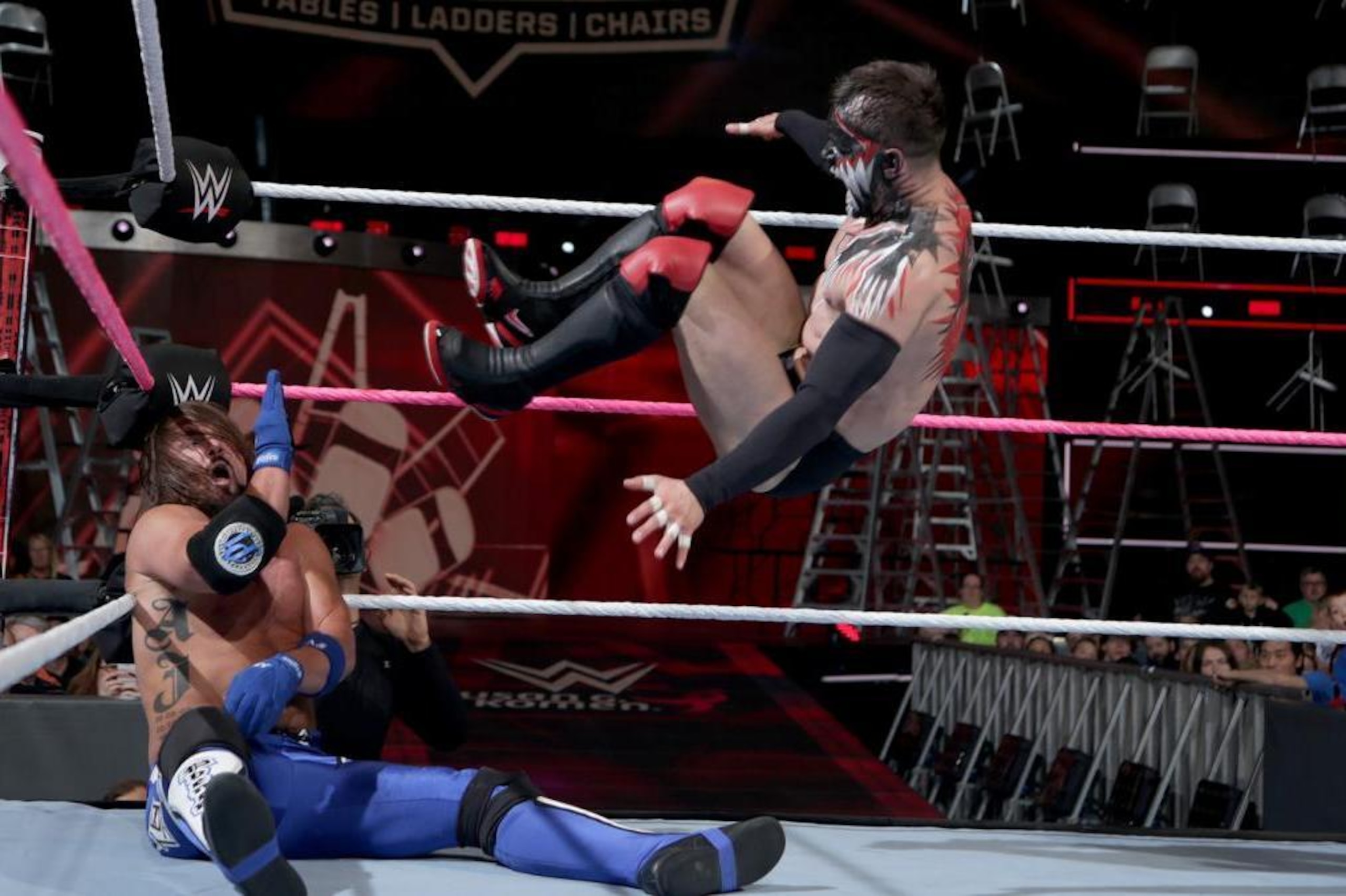 Finn Balor nails AJ Styles with a running dropkick at TLC.