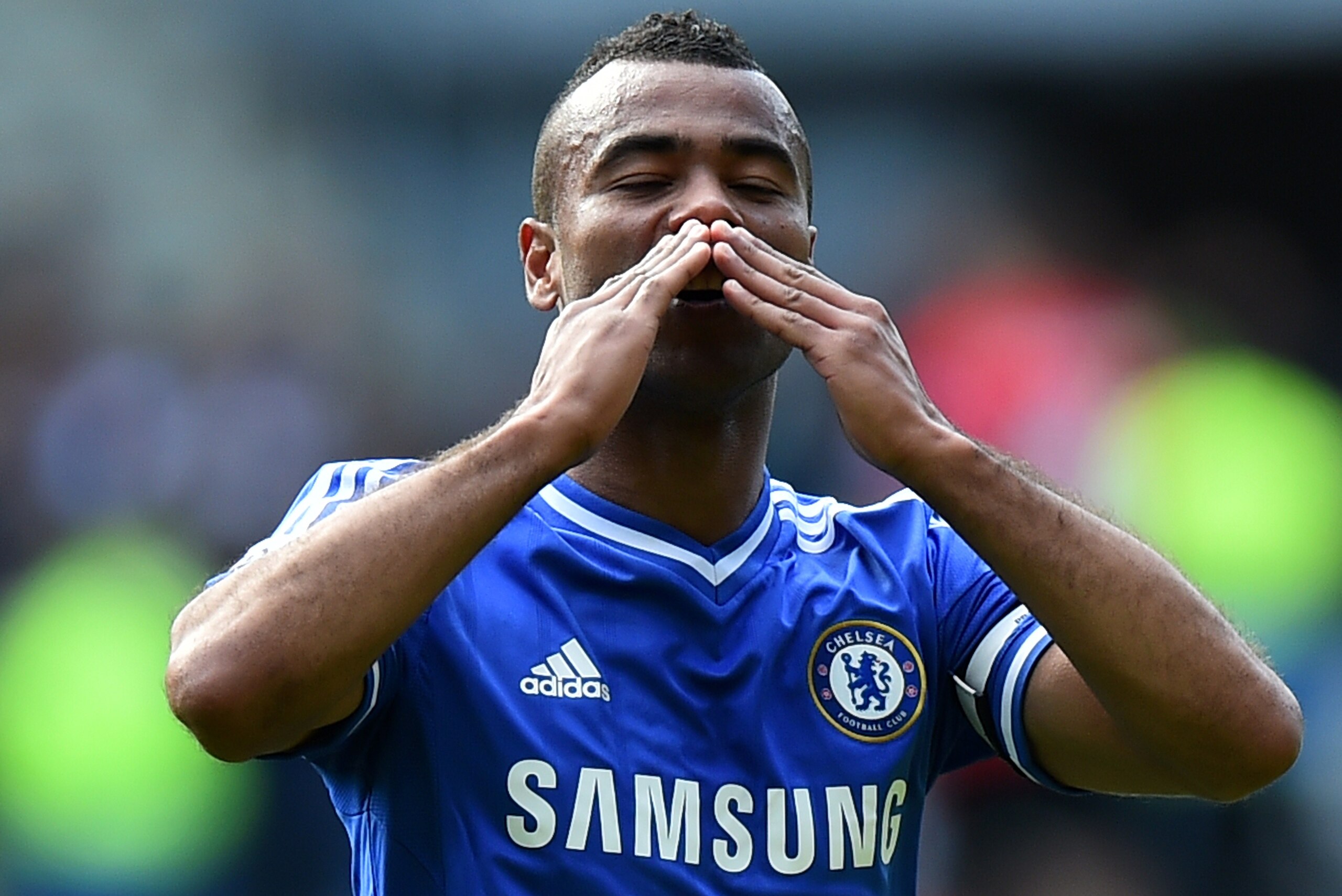 Chelsea's English defender Ashley Cole gestures to Chelsea fans following the English Premier League football match between Cardiff City and Chelsea at the Cardiff City Stadium in Cardiff on May 11, 2014. Chelsea won 2-1. AFP PHOTO/BEN STANSALL - RESTRIC Chelsea's English defender Ashley Cole gestures to Chelsea fans following the English Premier League football match between Cardiff City and Chelsea at the Cardiff City Stadium in Cardiff on May 11, 2014. Chelsea won 2-1. AFP PHOTO/BEN STANSALL - RESTRIC