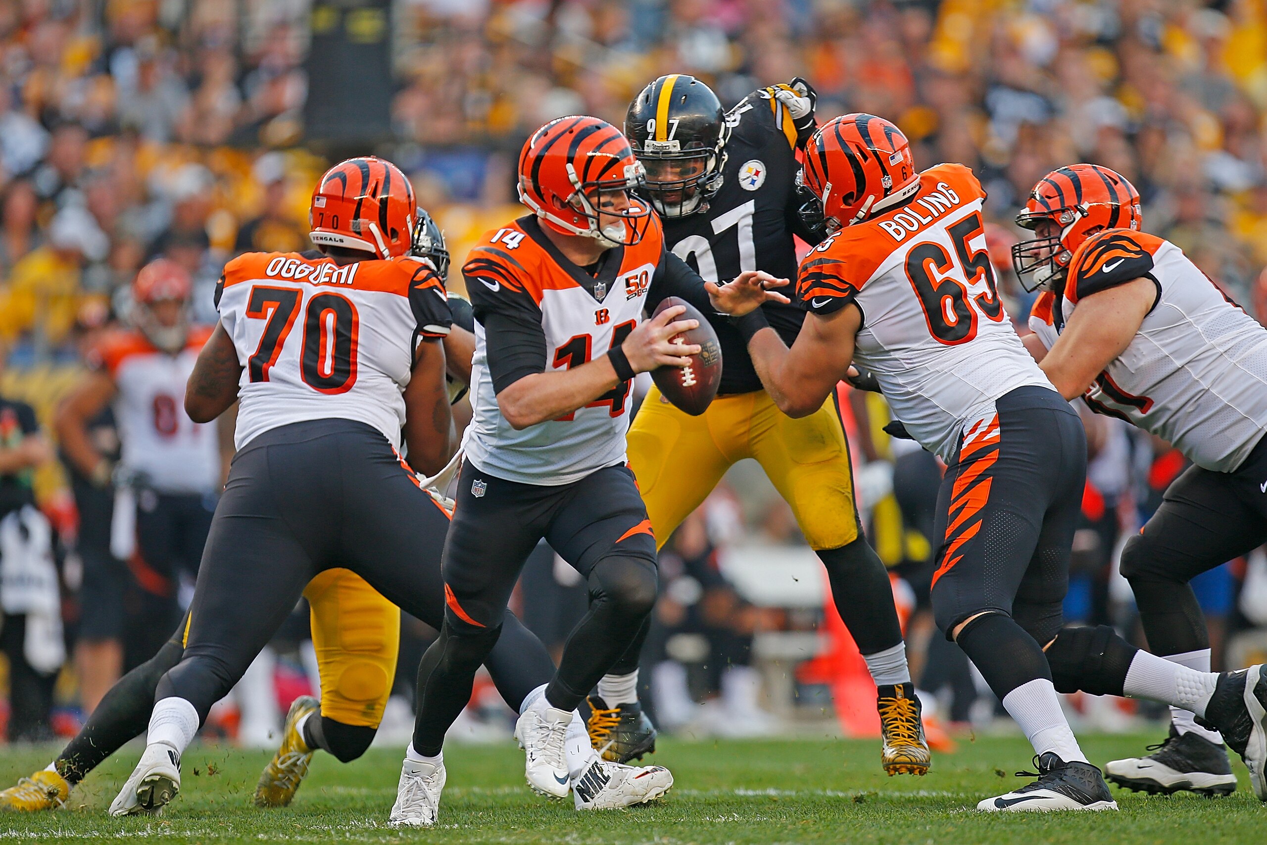 PITTSBURGH, PA - OCTOBER 22: Andy Dalton #14 of the Cincinnati Bengals scrambles out of the pocket in the first half during the game against the Pittsburgh Steelers at Heinz Field on October 22, 2017 in Pittsburgh, Pennsylvania. (Photo by Justin K. Aller/