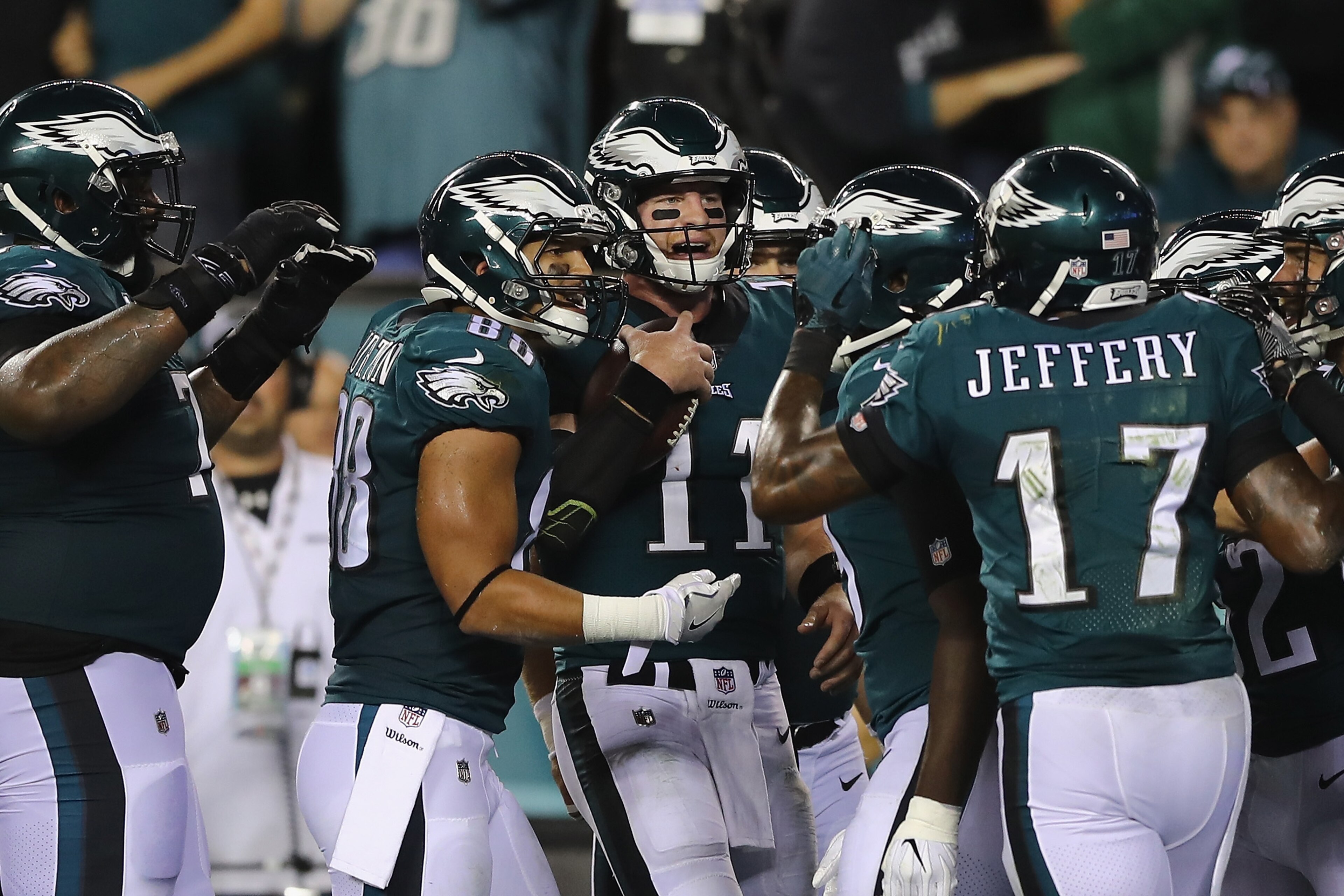 PHILADELPHIA, PA - OCTOBER 23: Quarterback Carson Wentz #11 of the Philadelphia Eagles celebrates a touchdown by Zach Ertz #86 with Trey Burton #88 and Alshon Jeffery #17 during the second quarter of the game against the Washington Redskins at Lincoln Fi PHILADELPHIA, PA - OCTOBER 23: Quarterback Carson Wentz #11 of the Philadelphia Eagles celebrates a touchdown by Zach Ertz #86 with Trey Burton #88 and Alshon Jeffery #17 during the second quarter of the game against the Washington Redskins at Lincoln Fi