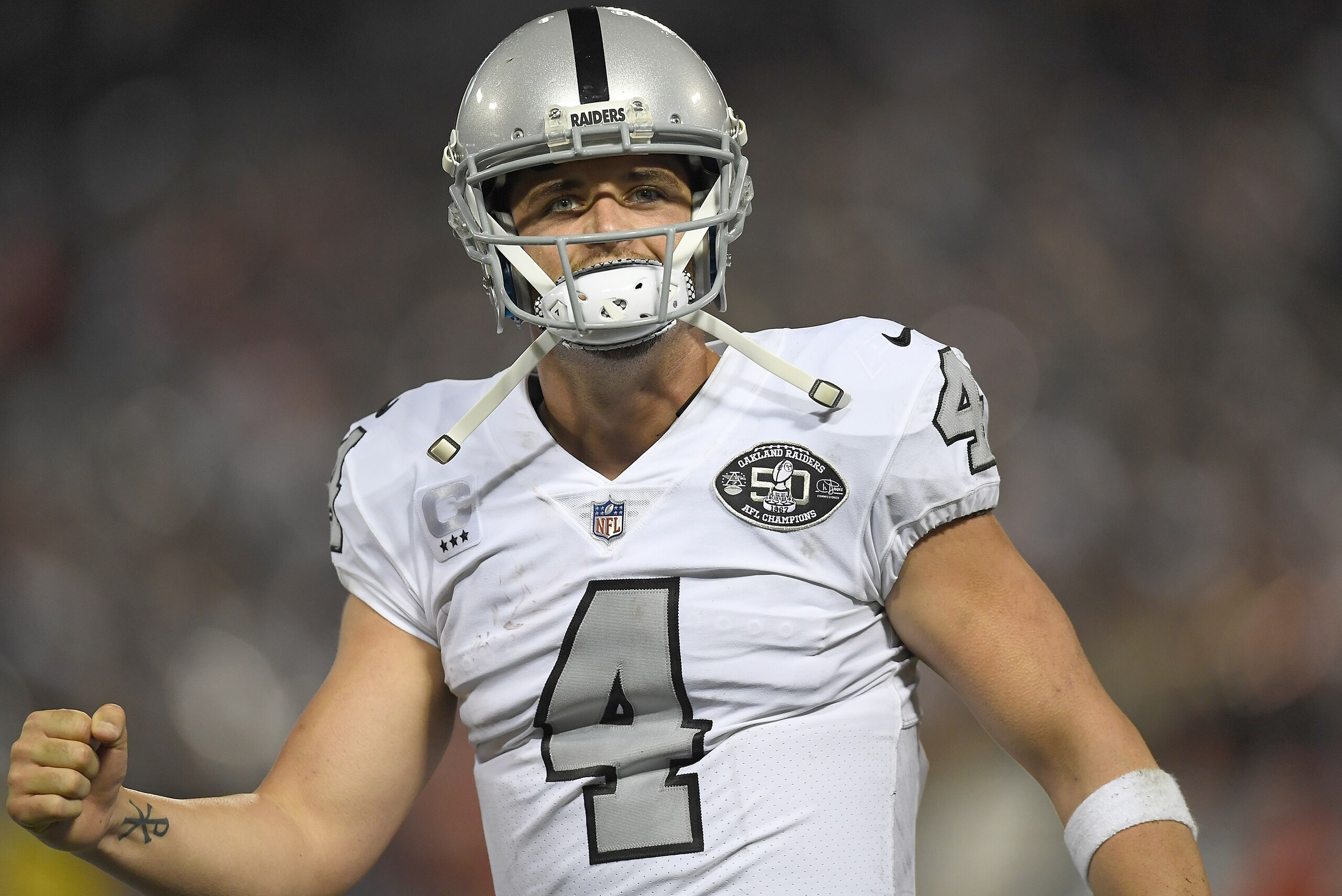 OAKLAND, CA - OCTOBER 19:  Derek Carr #4 of the Oakland Raiders celebrates after they scored a touchdown against the Kansas City Chiefs during their NFL football game at Oakland-Alameda County Coliseum on October 19, 2017 in Oakland, California.  (Photo b