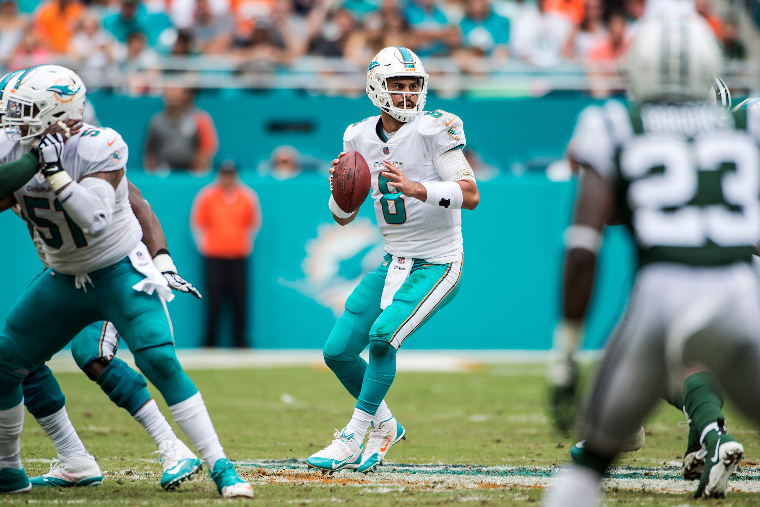 MIAMI GARDENS, FL - OCTOBER 22:  Quarterback Matt Moore #8 of the Miami Dolphins looks for a receiver during a NFL game against the New York Jets at Hard Rock Stadium on October 22, 2017 in Miami Gardens, Florida.  (Photo by Ronald C. Modra/Sports Imagery