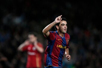 BARCELONA, SPAIN - DECEMBER 09:  Xavi Hernandez of Barcelona celebrates his goal during the La Liga match between Barcelona and Deportivo La Coruna at the Camp Nou Stadium on December 9, 2007 in Barcelona, Spain. Barcelona won the match 2-1.  (Photo by Ja