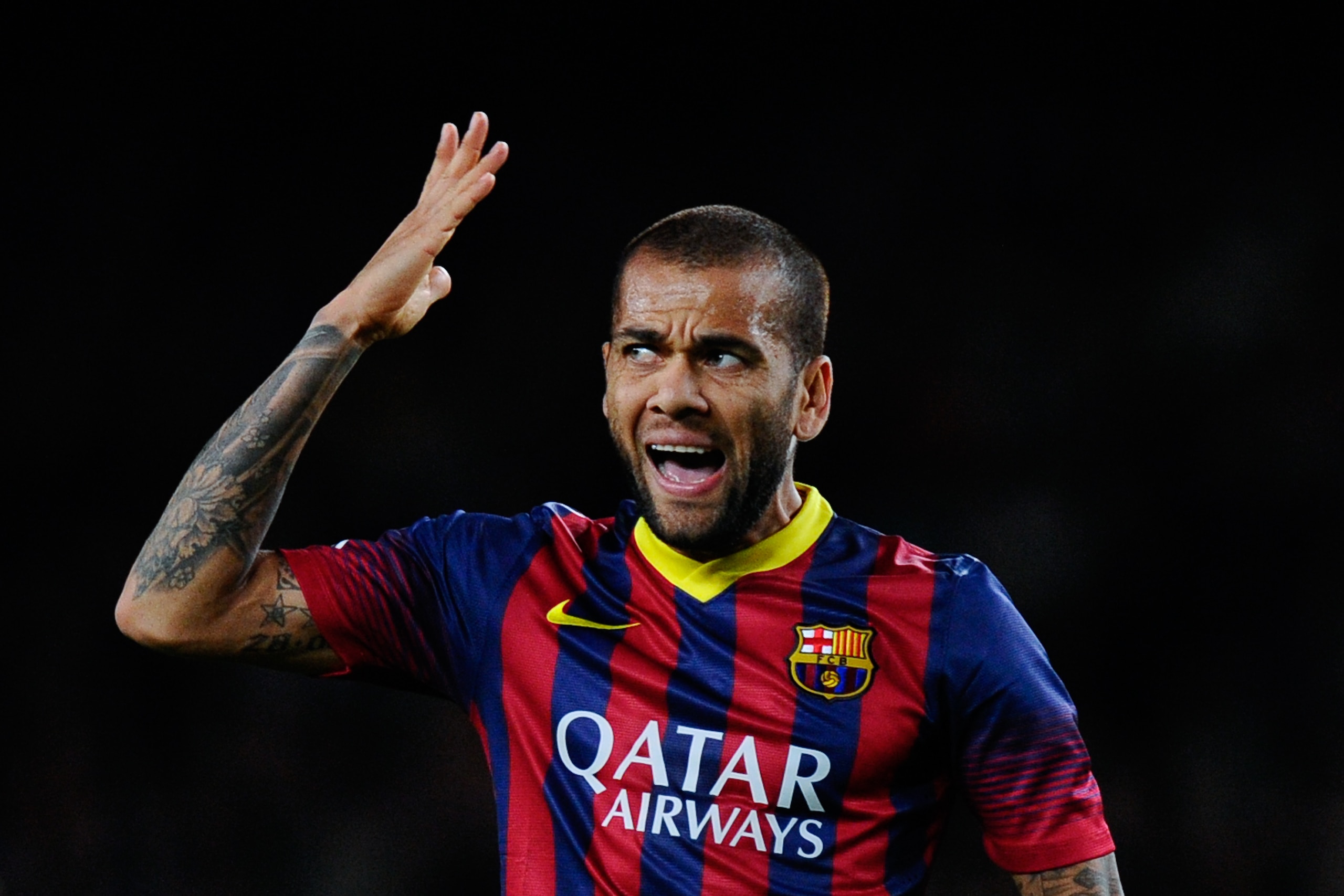 BARCELONA, SPAIN - NOVEMBER 01:  Dani Alves of FC Barcelona reacts after missing a chance to score during the La Liga match between FC Barcelona and RCD Espanyol at Camp Nou on November 1, 2013 in Barcelona, Spain.  (Photo by David Ramos/Getty Images)