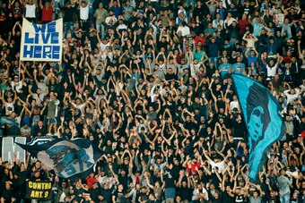 Napoli's fans cheer during the UEFA Champion's League Group F football match Napoli vs Feyenoord Rotterdam on September 26, 2017 at the San Paolo stadium in Naples.  / AFP PHOTO / Carlo Hermann        (Photo credit should read CARLO HERMANN/AFP/Getty Imag