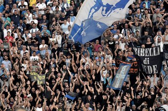 Napoli's supporters cheer their team during the Serie A football match between Spal and Napoli at Paolo Mazza Stadium in Ferrara on September 23, 2017.  / AFP PHOTO / TIZIANA FABI        (Photo credit should read TIZIANA FABI/AFP/Getty Images)