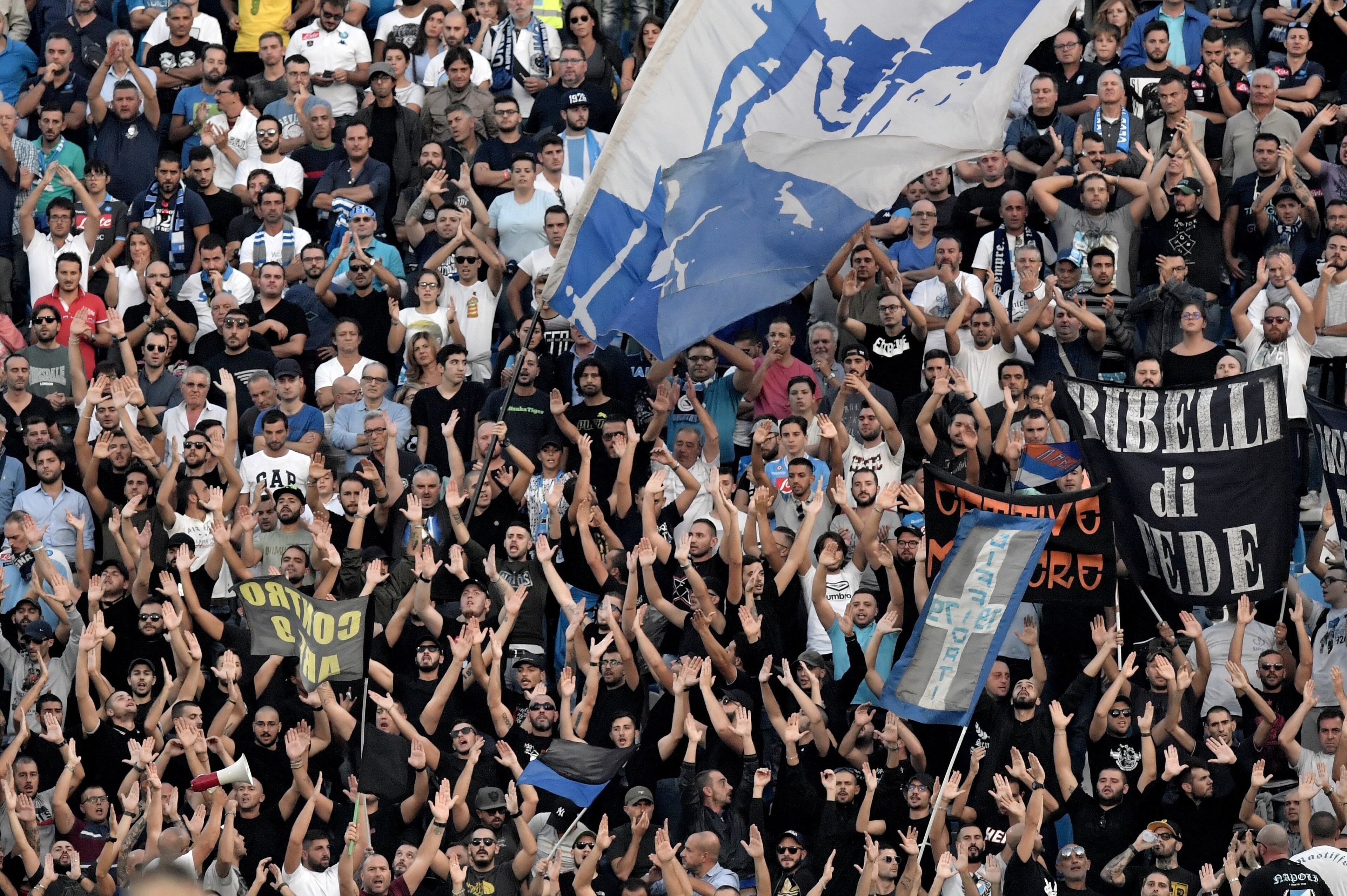 Napoli's supporters cheer their team during the Serie A football match between Spal and Napoli at Paolo Mazza Stadium in Ferrara on September 23, 2017.  / AFP PHOTO / TIZIANA FABI        (Photo credit should read TIZIANA FABI/AFP/Getty Images)
