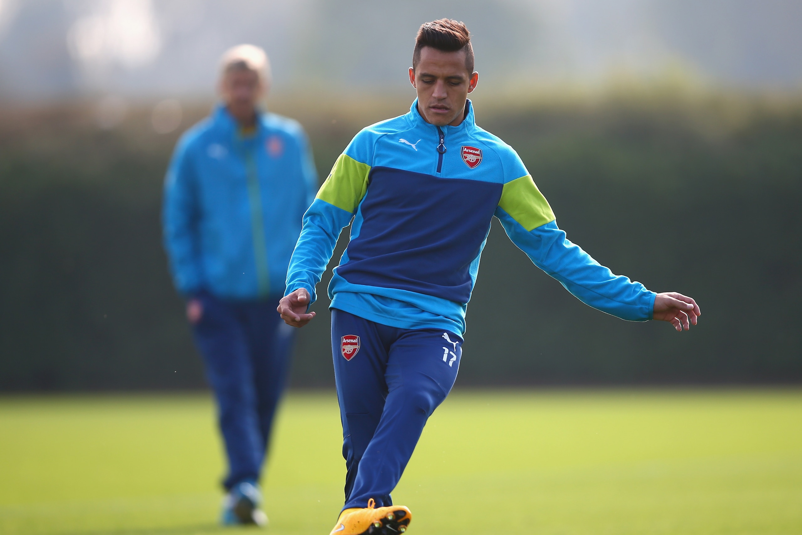 ST ALBANS, ENGLAND - SEPTEMBER 30:  Alexis Sanchez of Arsenal in action during an Arsenal training session ahead of their UEFA Champions League Group D match against Galatasaray at London Colney on September 30, 2014 in St Albans, England.  (Photo by Paul