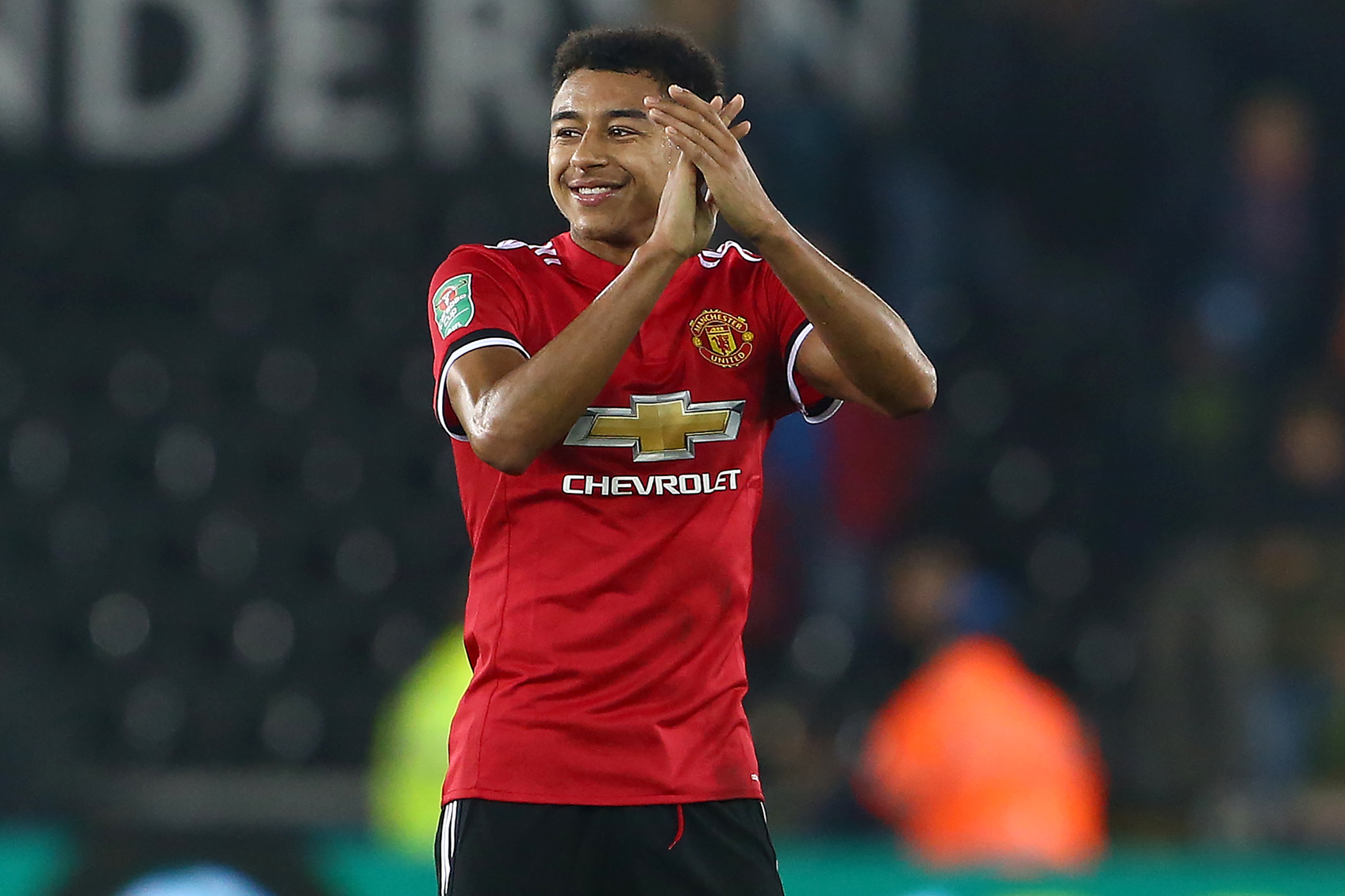 Manchester United's English midfielder Jesse Lingard applauds the fans following the English League Cup fourth round football match between Swansea City and Manchester United at The Liberty Stadium in Swansea, south Wales on October 24, 2017. / AFP PHOTO Manchester United's English midfielder Jesse Lingard applauds the fans following the English League Cup fourth round football match between Swansea City and Manchester United at The Liberty Stadium in Swansea, south Wales on October 24, 2017. / AFP PHOTO