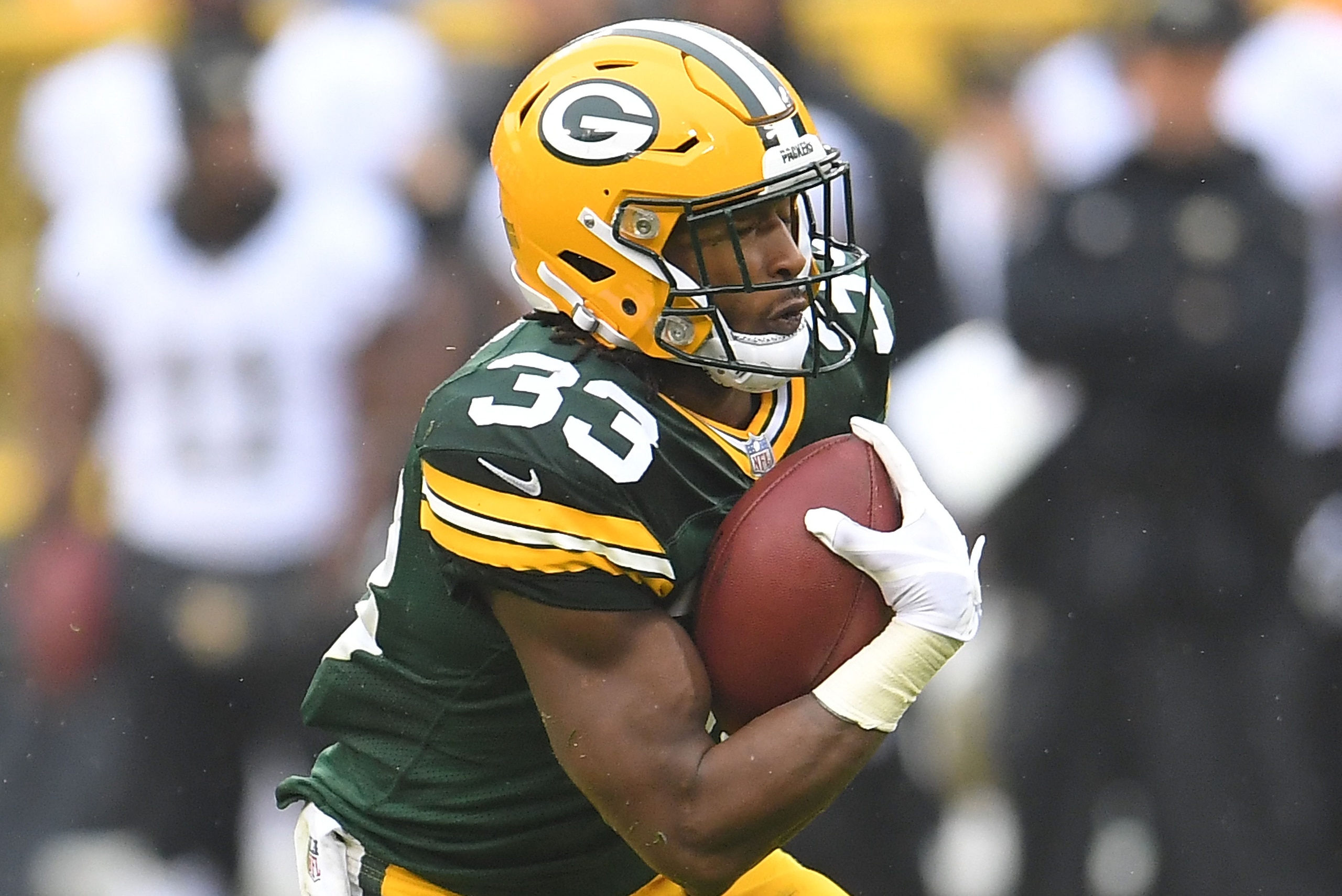 GREEN BAY, WI - OCTOBER 22: Aaron Jones #33 of the Green Bay Packers runs for yards during a game against the New Orleans Saints at Lambeau Field on October 22, 2017 in Green Bay, Wisconsin. The Saints defeated the Packers 26-17. (Photo by Stacy Revere GREEN BAY, WI - OCTOBER 22: Aaron Jones #33 of the Green Bay Packers runs for yards during a game against the New Orleans Saints at Lambeau Field on October 22, 2017 in Green Bay, Wisconsin. The Saints defeated the Packers 26-17. (Photo by Stacy Revere