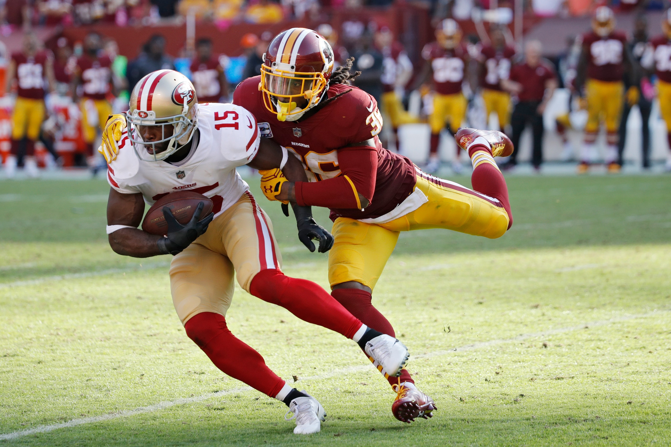 LANDOVER, MD - OCTOBER 15: D.J. Swearinger #36 of the Washington Redskins tackles Pierre Garcon #15 of the San Francisco 49ers during a game at FedEx Field on October 15, 2017 in Landover, Maryland. The Redskins won 26-24. (Photo by Joe Robbins/Getty Imag LANDOVER, MD - OCTOBER 15: D.J. Swearinger #36 of the Washington Redskins tackles Pierre Garcon #15 of the San Francisco 49ers during a game at FedEx Field on October 15, 2017 in Landover, Maryland. The Redskins won 26-24. (Photo by Joe Robbins/Getty Imag