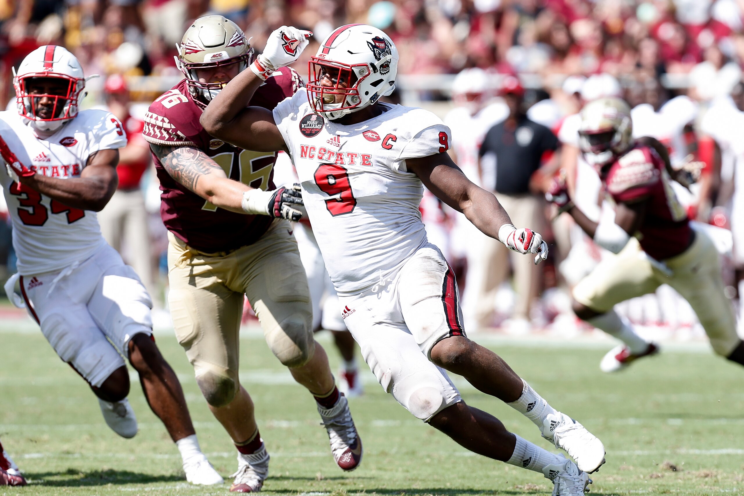 TALLAHASSEE, FL - SEPTEMBER 23: Defensive End Bradley Chubb #9 of the North Carolina State Wolfpack beats Tackle Rick Leonard #76 of the Florida State Seminoles during the game at Doak Campbell Stadium on Bobby Bowden Field on September 23, 2017 in Tallah