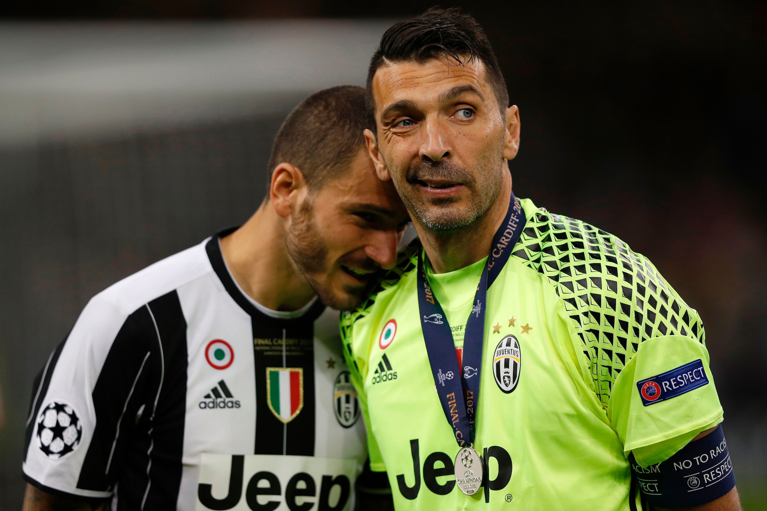 Juventus' Italian goalkeeper Gianluigi Buffon (R) reacts with Juventus' Italian defender Leonardo Bonucci after losing the UEFA Champions League final football match between Juventus and Real Madrid at The Principality Stadium in Cardiff, south Wales, on 
