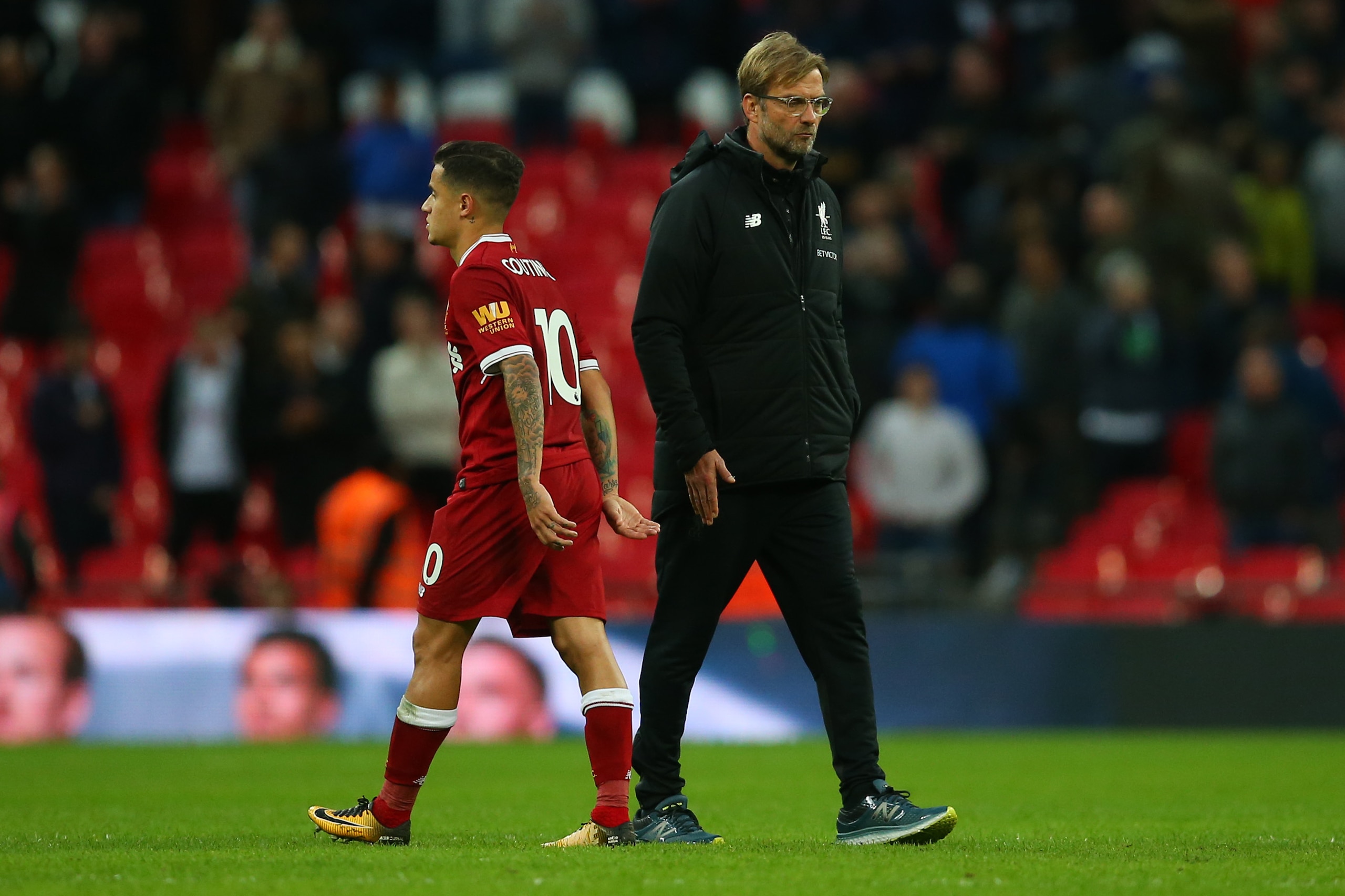 LONDON, ENGLAND - OCTOBER 22: Jurgen Klopp the head coach / manager of Liverpool walks past Philippe Coutinho of Liverpool after the Premier League match between Tottenham Hotspur and Liverpool at Wembley Stadium on October 22, 2017 in London, England. (P